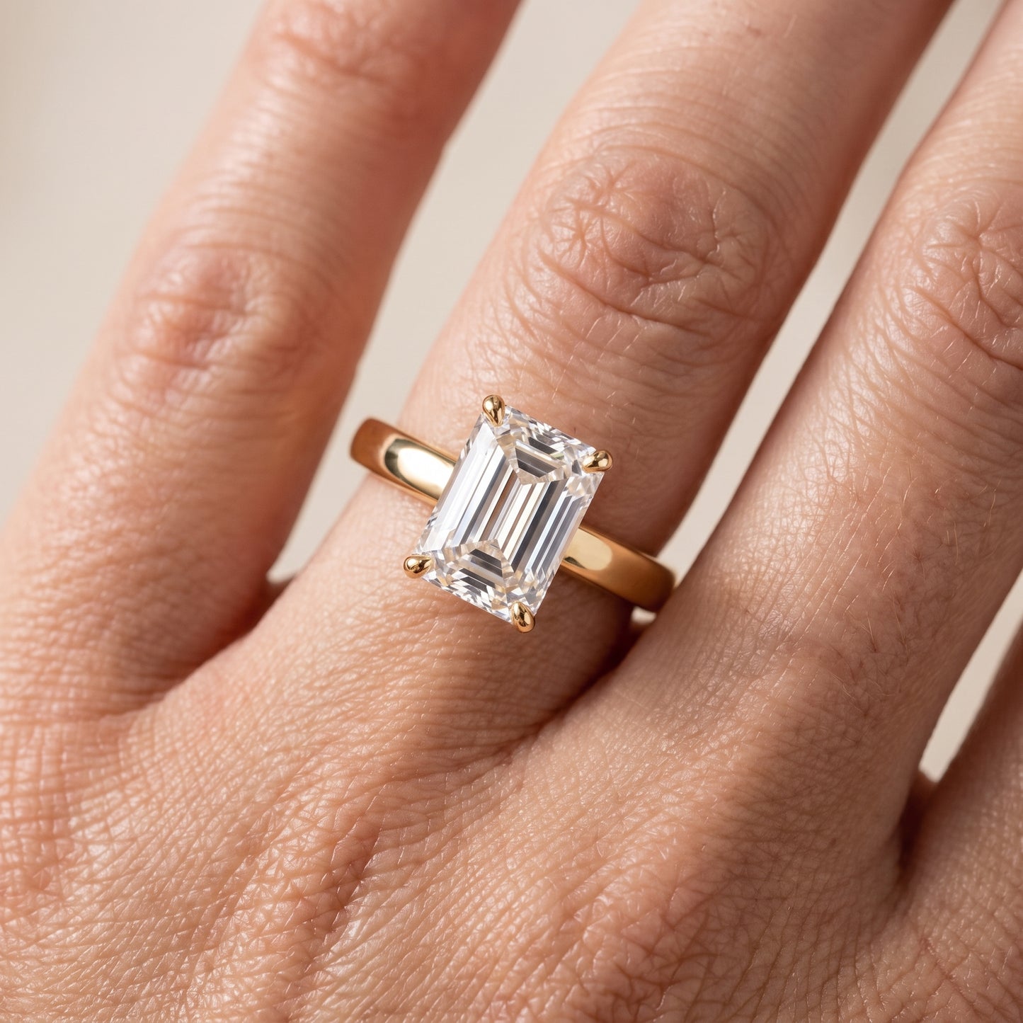 Lara Hidden Halo Emerald Diamond Engagement Ring in Yellow Gold - lifestyle.jpg