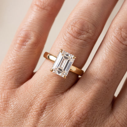 Lara Hidden Halo Emerald Diamond Engagement Ring in Yellow Gold - lifestyle.jpg