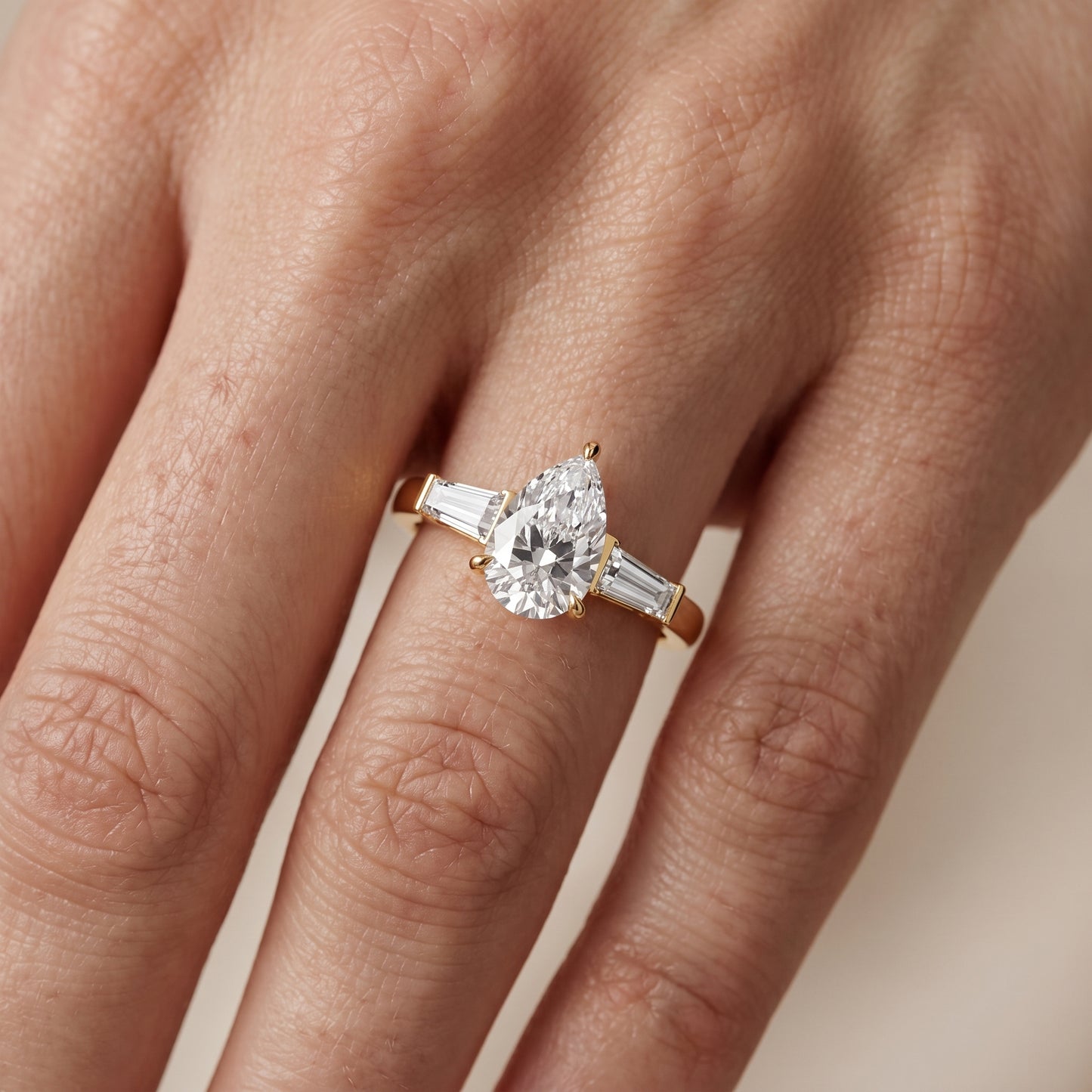 Zelda Tapered Baguette Pear Diamond Engagement Ring in Yellow Gold - lifestyle.jpg