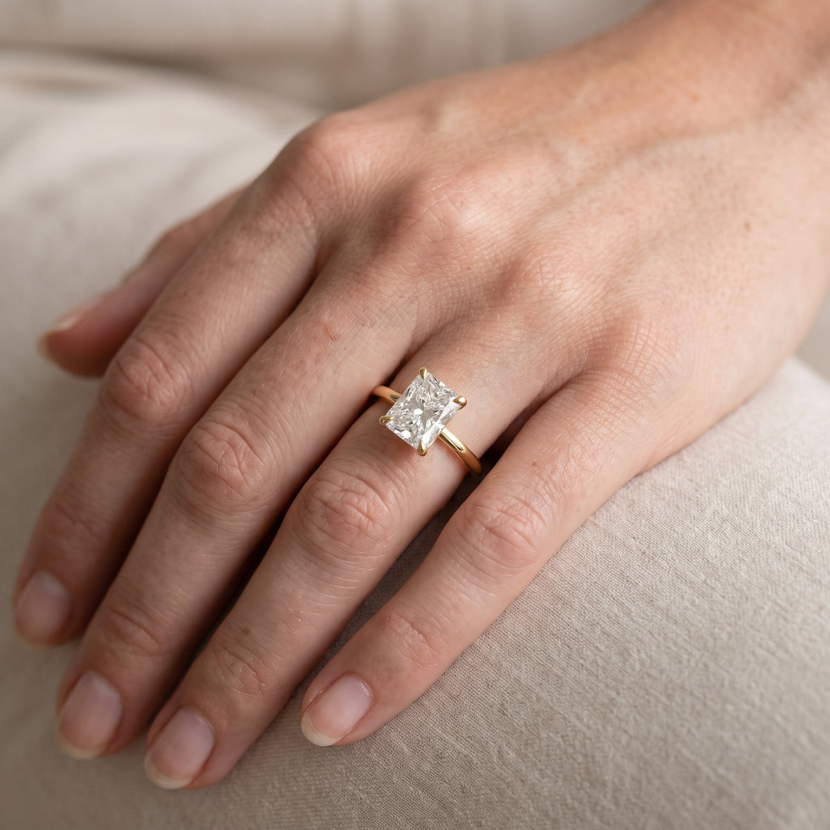 Nella Petite Solitaire Radiant Diamond Engagement Ring in Yellow Gold - lifestyle.jpg