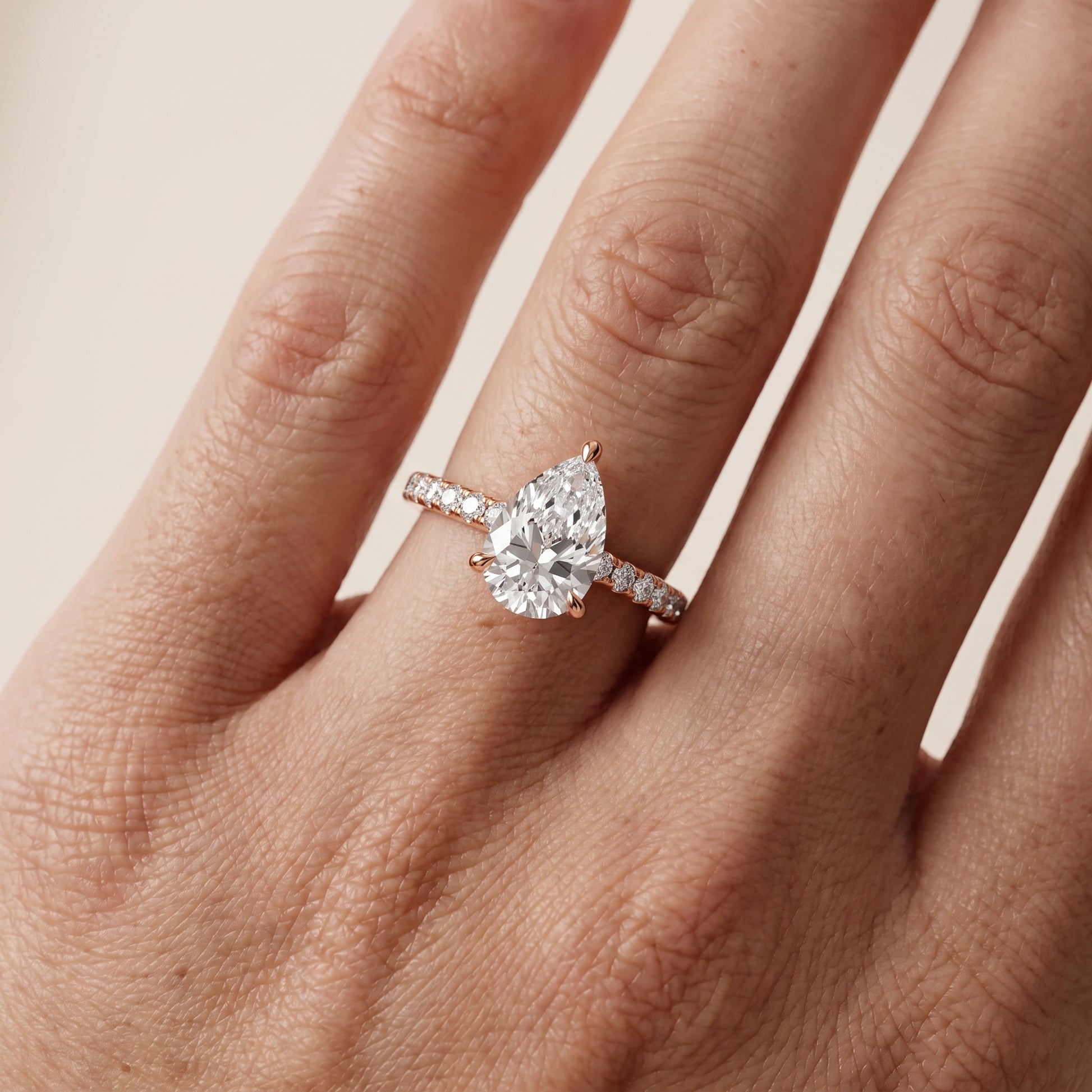 Maya Hidden Halo Pavé Pear Diamond Engagement Ring in Rose Gold - lifestyle.jpg
