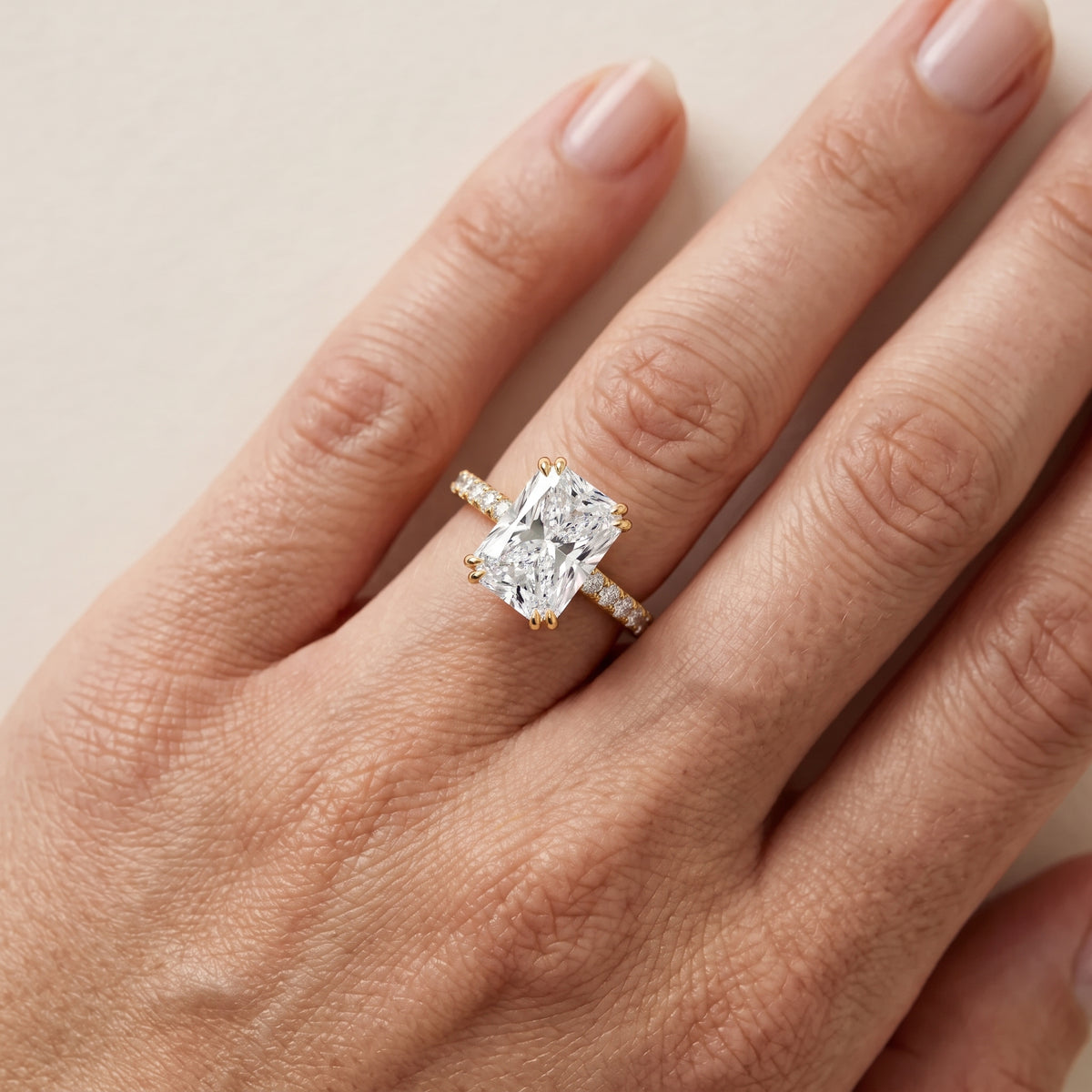 Luna Solitaire Pavé Radiant Diamond Engagement Ring in Yellow Gold - lifestyle.jpg
