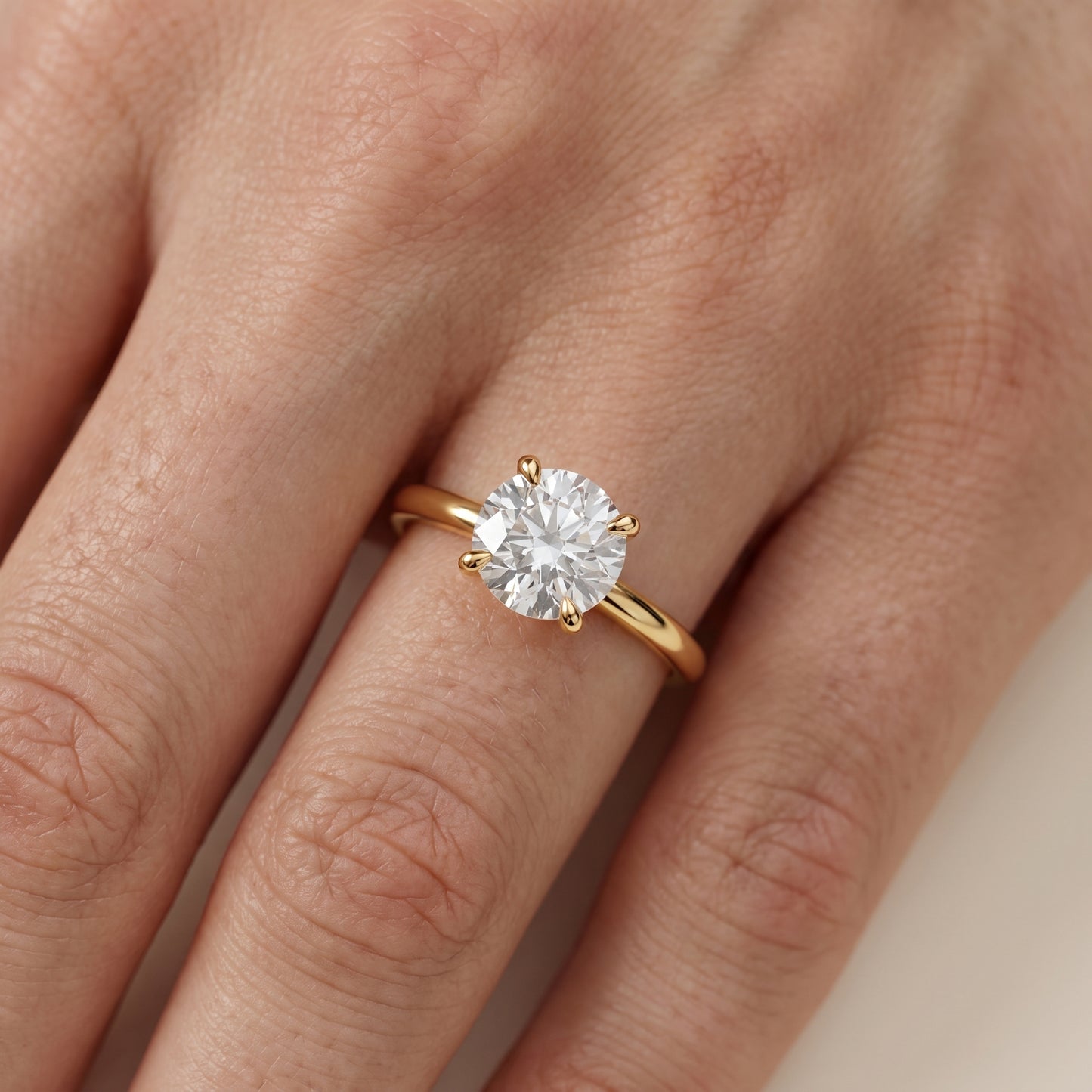 Nella Petite Solitaire Round Diamond Engagement Ring in Yellow Gold - lifestyle.jpg