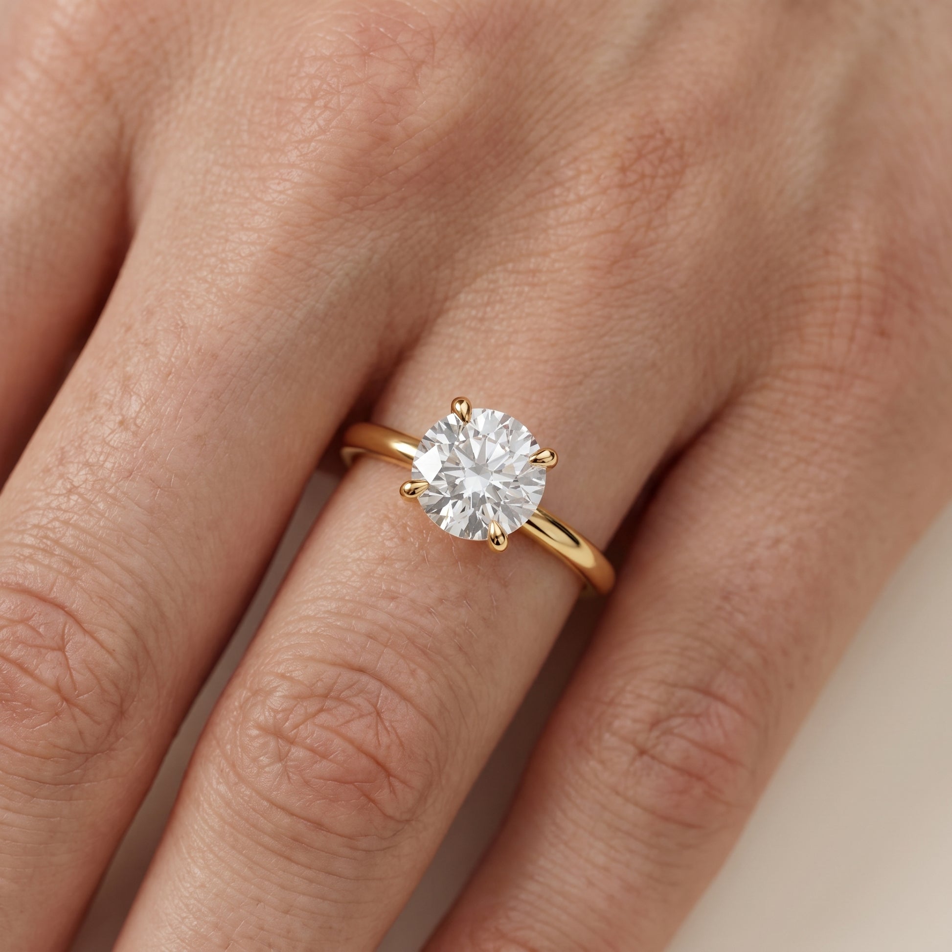 Nella Petite Solitaire Round Diamond Engagement Ring in Yellow Gold - lifestyle.jpg