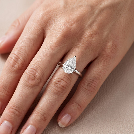 Maisie Four Prong Solitaire Pear Diamond Engagement Ring in Platinum - lifestyle.jpg