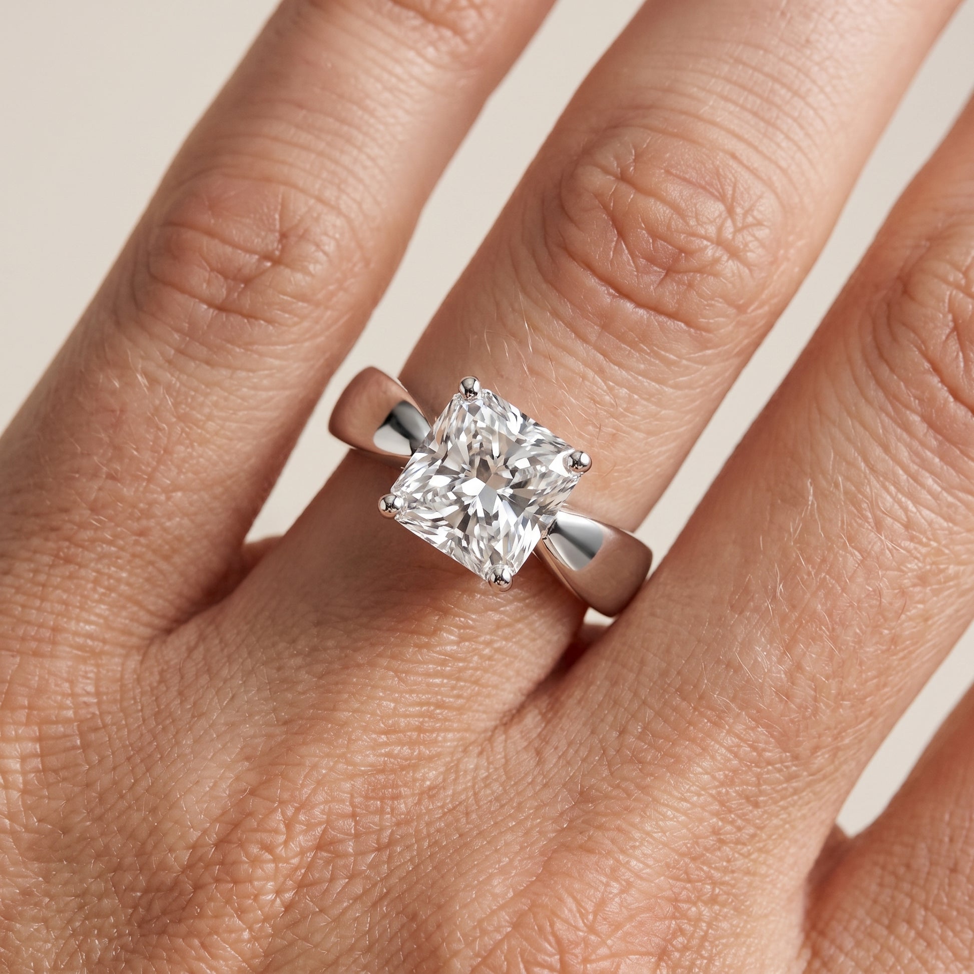 Talia Solitaire Twist Radiant Diamond Engagement Ring in Platinum - lifestyle.jpg