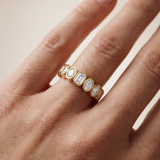 Mika Bezel Oval & Emerald Diamond Eternity Band in Yellow Gold - lifestyle.jpg