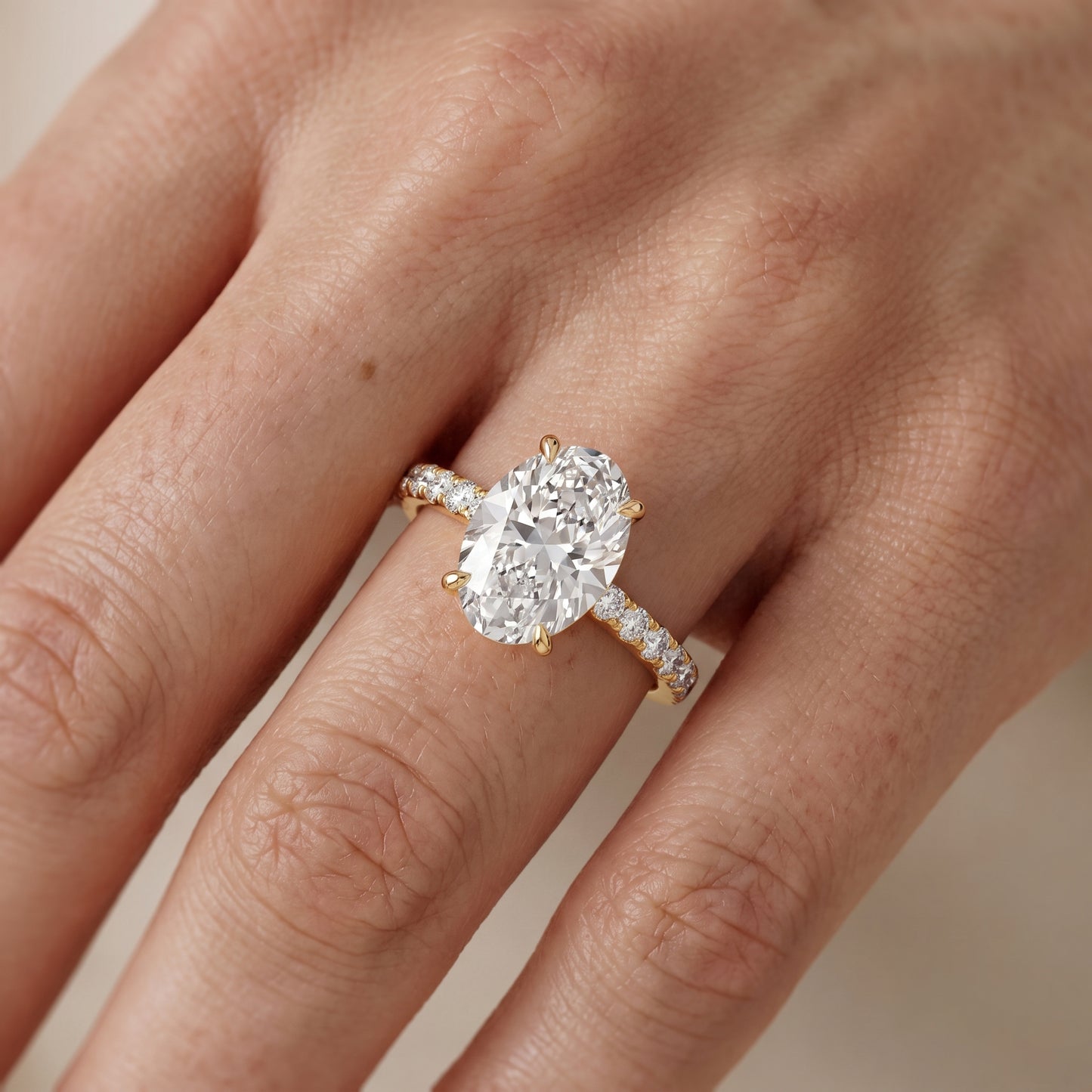 Veda Split Shank Pavé Oval Diamond Engagement Ring in Yellow Gold - lifestyle.jpg