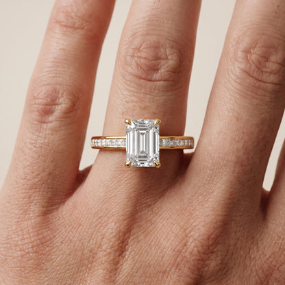 Maren Sidestone Channel Set Emerald Diamond Engagement Ring in Yellow Gold - lifestyle.jpg