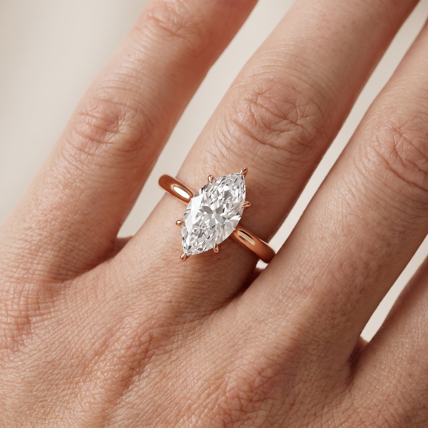 Evie Solitaire Six-Prong Marquise Diamond Engagement Ring in Rose Gold - lifestyle.jpg