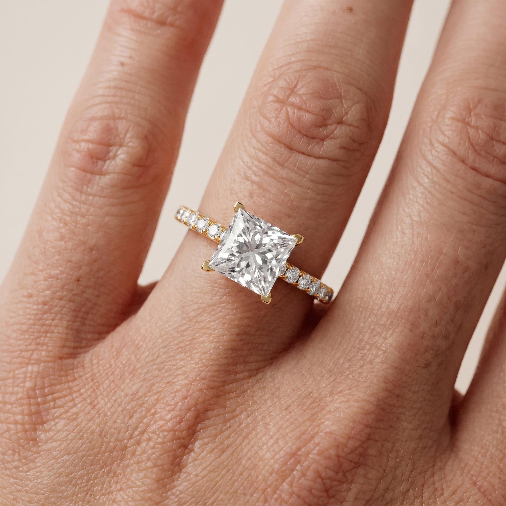 Juna French Pavé Solitaire Princess Diamond Engagement Ring in Yellow Gold - lifestyle.jpg
