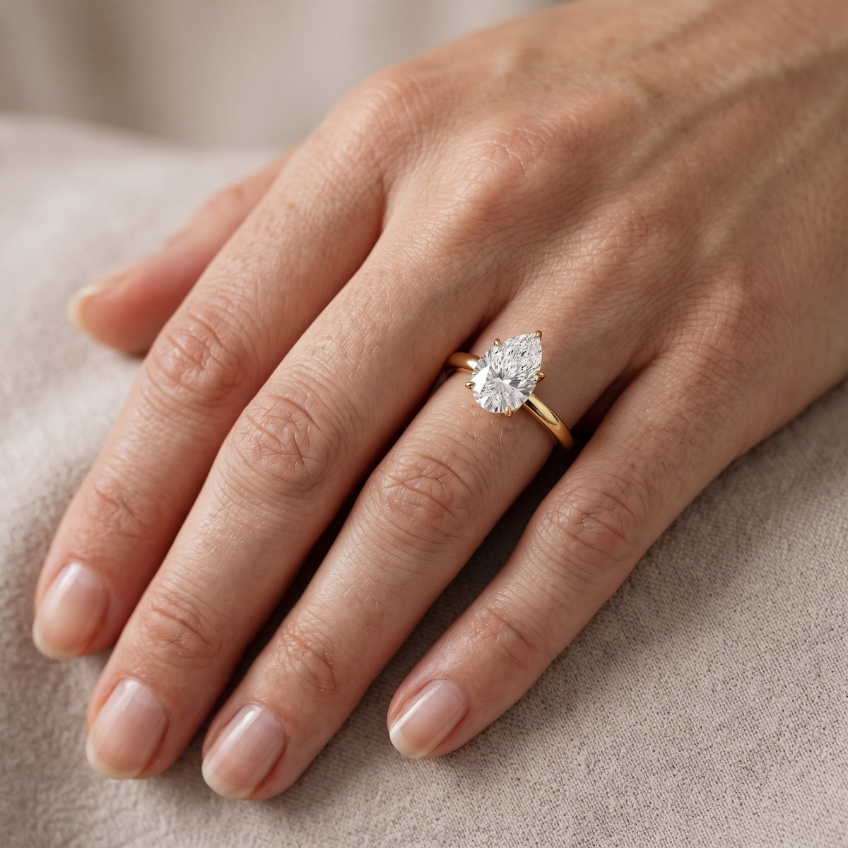 Serena Blossom Solitaire Pear Diamond Engagement Ring in Yellow Gold - lifestyle.jpg