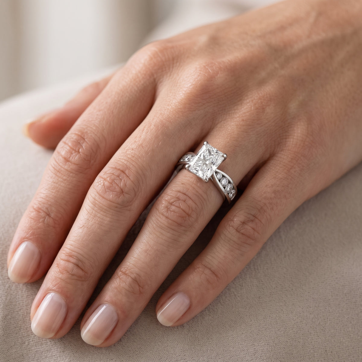 Rosalie Channel Set Sidestone Radiant Diamond Engagement Ring in Platinum - lifestyle.jpg