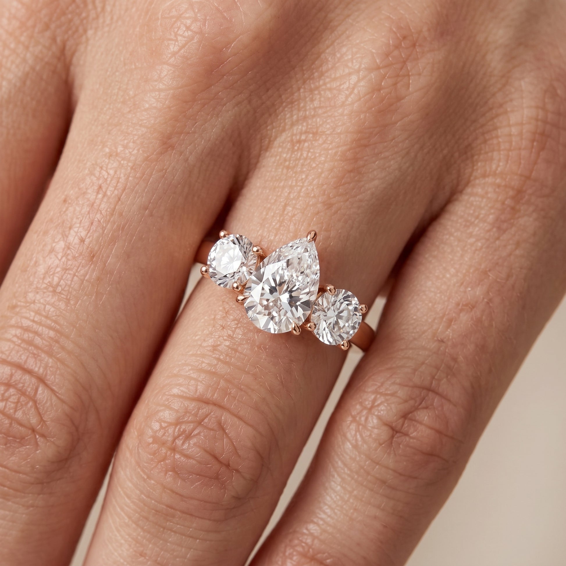 Esme Three-Stone Tapered Pear Diamond Ring in Rose Gold - lifestyle.jpg