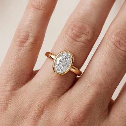 Alina Bezel Solitaire Oval Diamond Ring in Yellow Gold - lifestyle.jpg