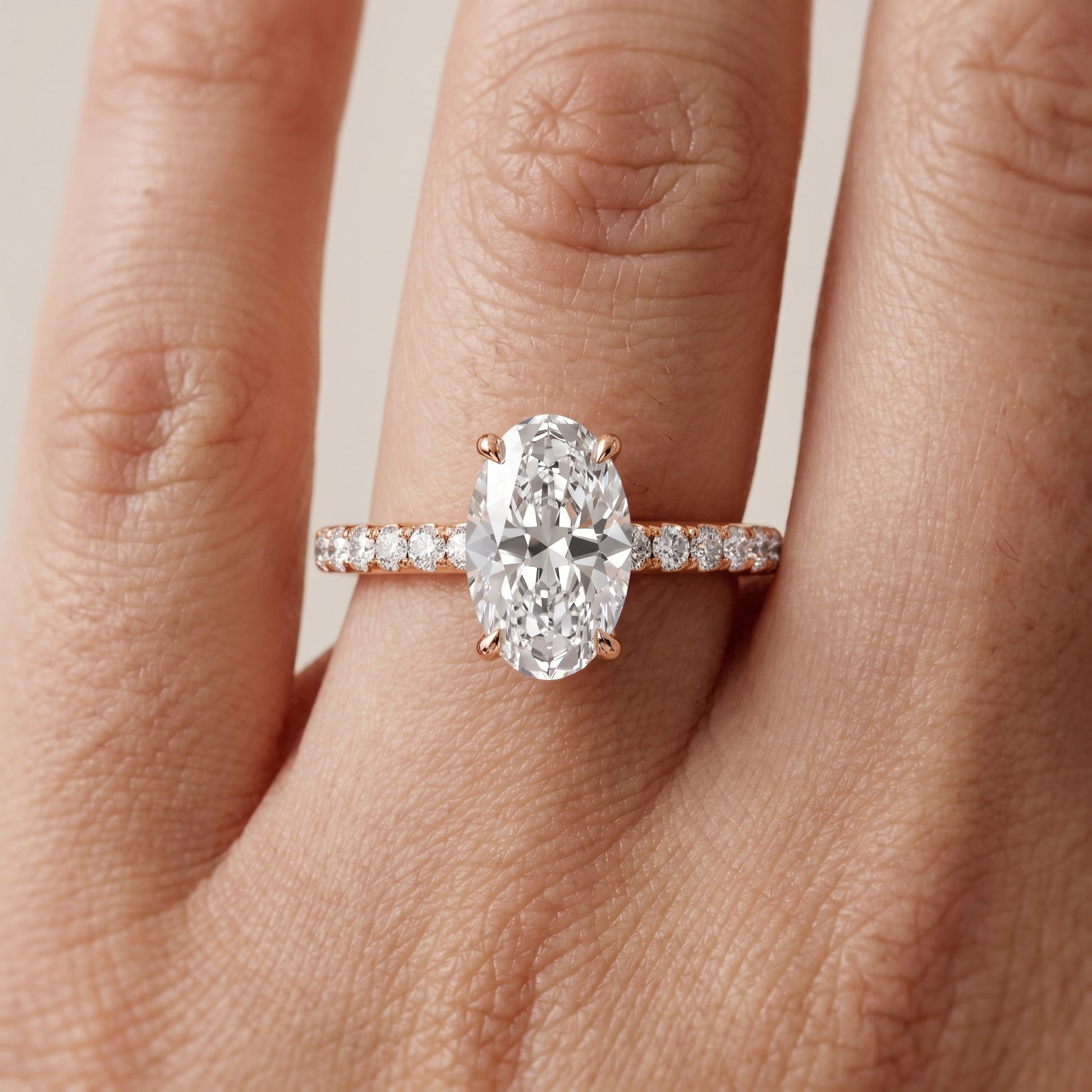 Thea Hidden Halo Pavé Oval Diamond Engagement Ring in Rose Gold - lifestyle.jpg