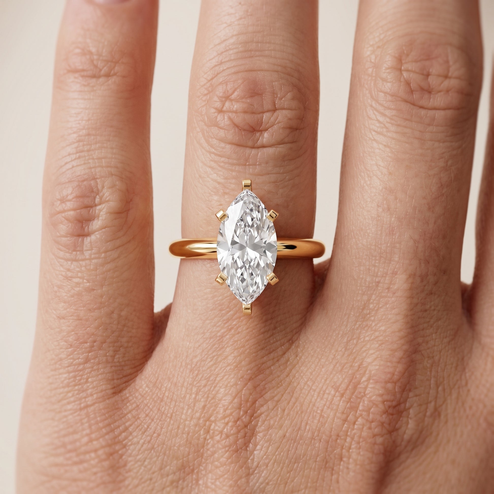 Amira Six-Prong Solitaire Marquise Diamond Engagement Ring in Yellow Gold - lifestyle.jpg