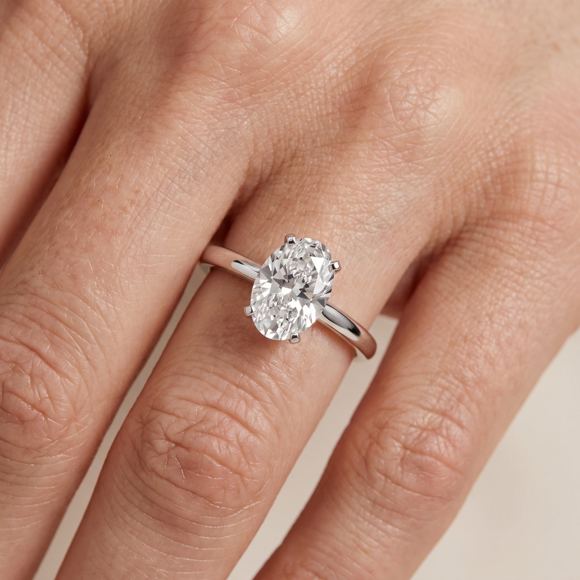 Liana Solitaire Claw Prong Oval Diamond Engagement Ring in Platinum - lifestyle.jpg