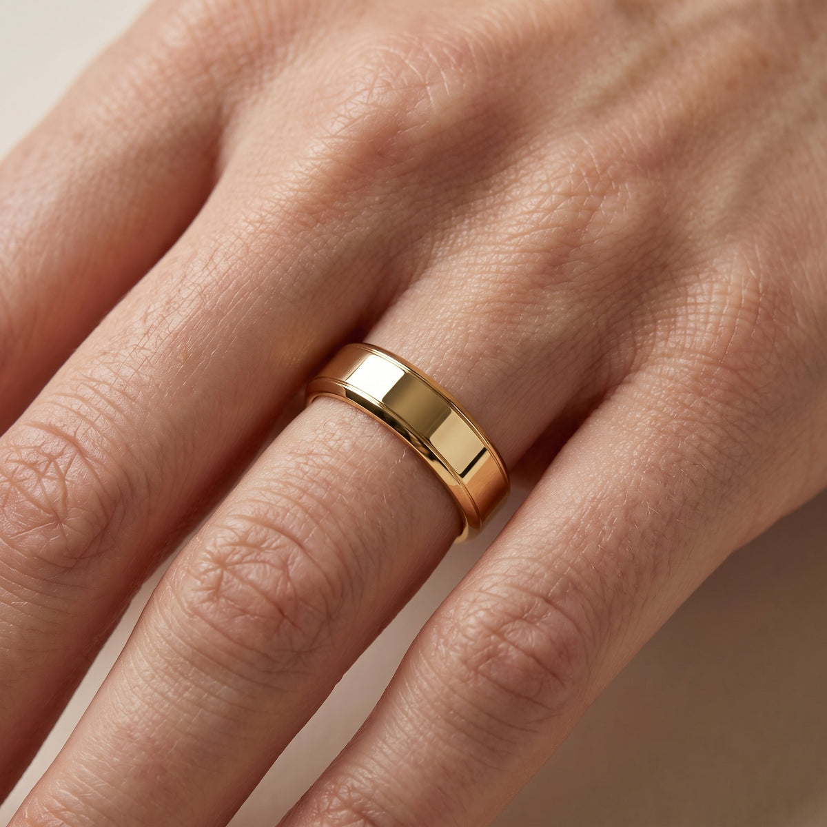 Anika Flat Beveled Wedding Band in Yellow Gold - lifestyle.jpg