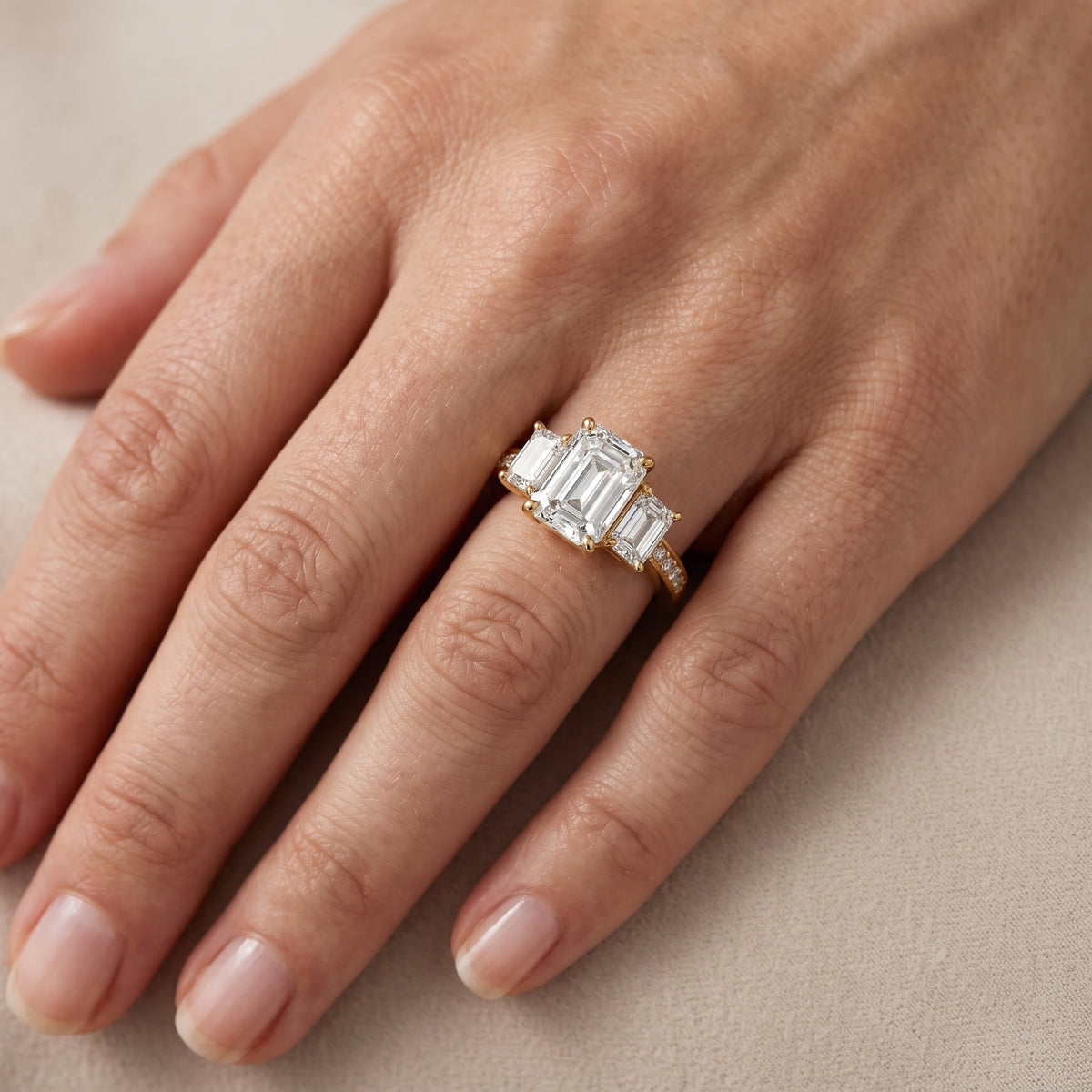 Ariana Three-Stone Pavé Emerald Diamond Engagement Ring in White Gold - lifestyle.jpg