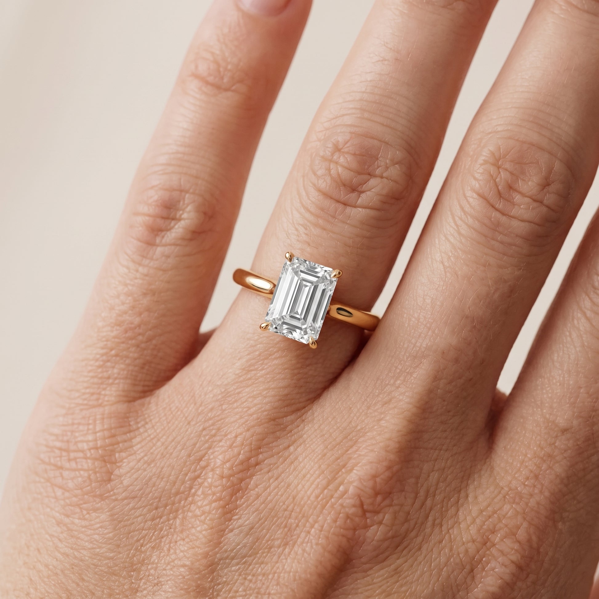 Evie Solitaire Six-Prong Emerald Diamond Engagement Ring in Yellow Gold - lifestyle.jpg
