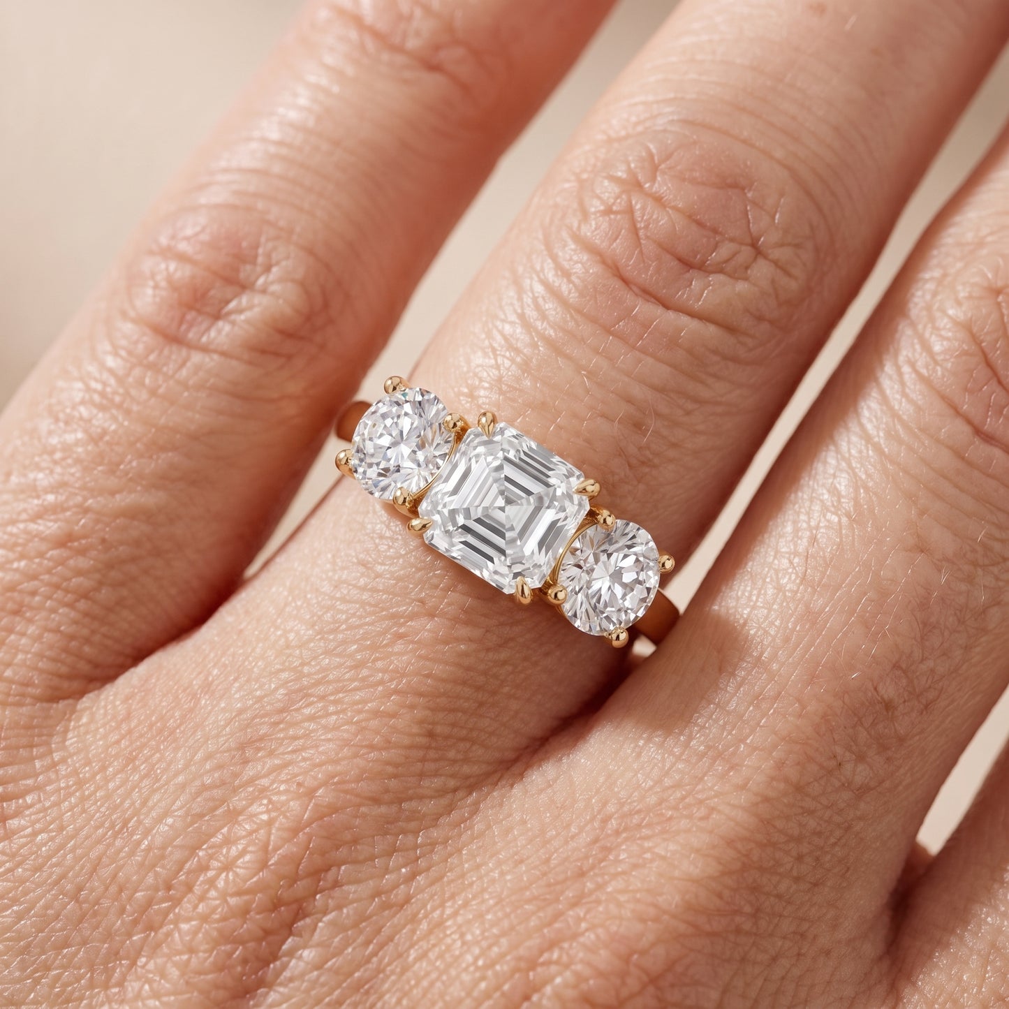Esme Three-Stone Tapered Asscher Diamond Ring in Yellow Gold - lifestyle.jpg