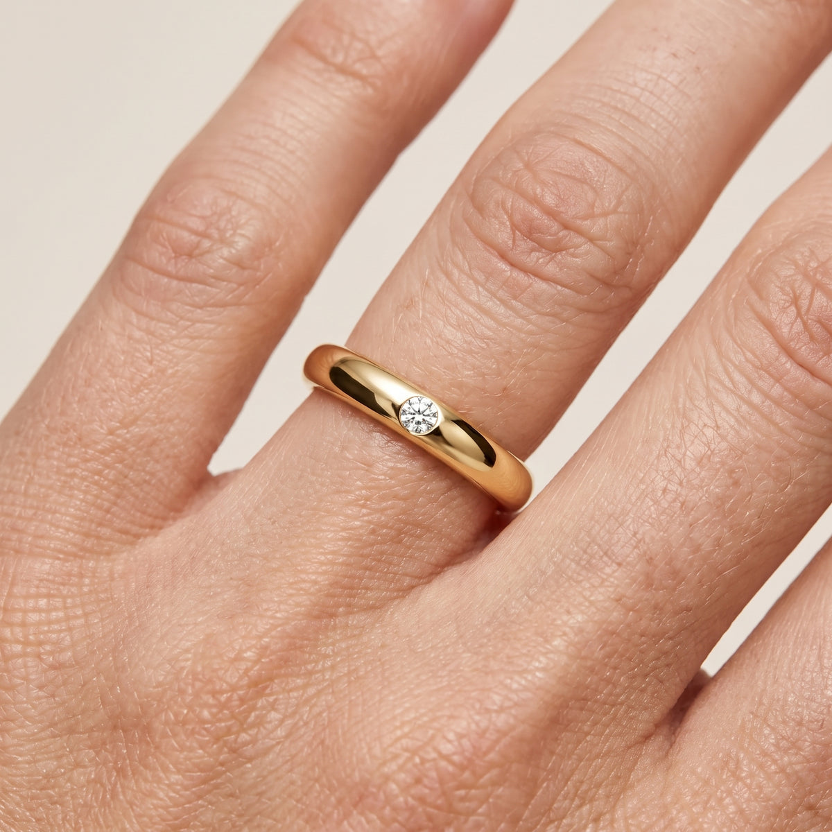 Elizabeth Comfort Fit Bezel Round Diamond Wedding Band in Yellow Gold - lifestyle.jpg
