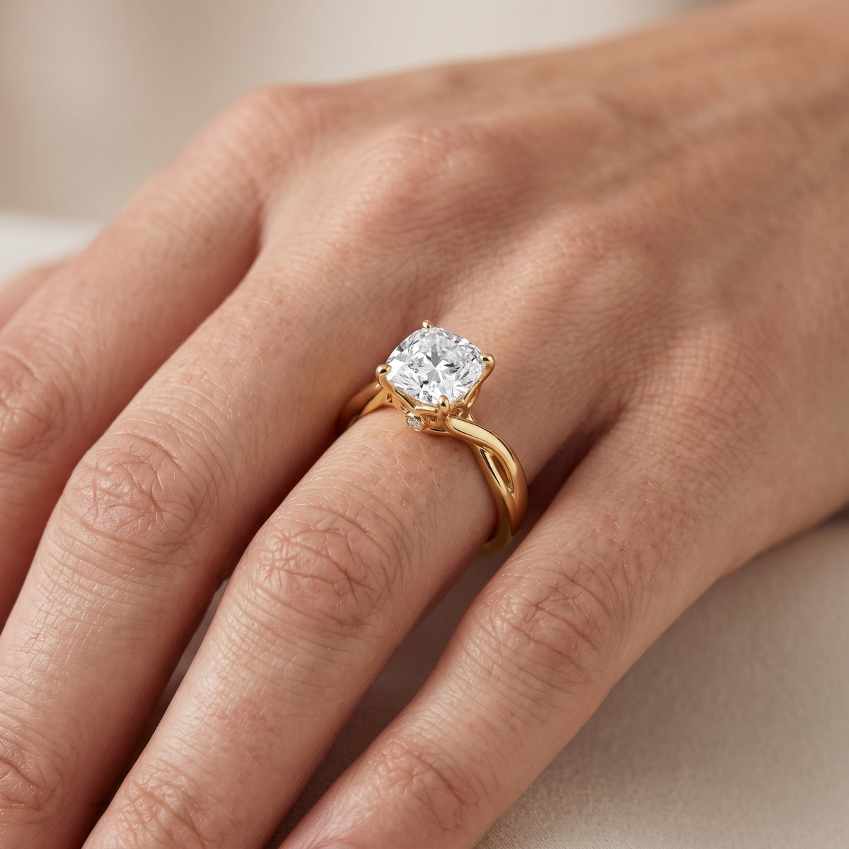 Britta Twist Cushion Diamond Engagement Ring in Yellow Gold - lifestyle.jpg
