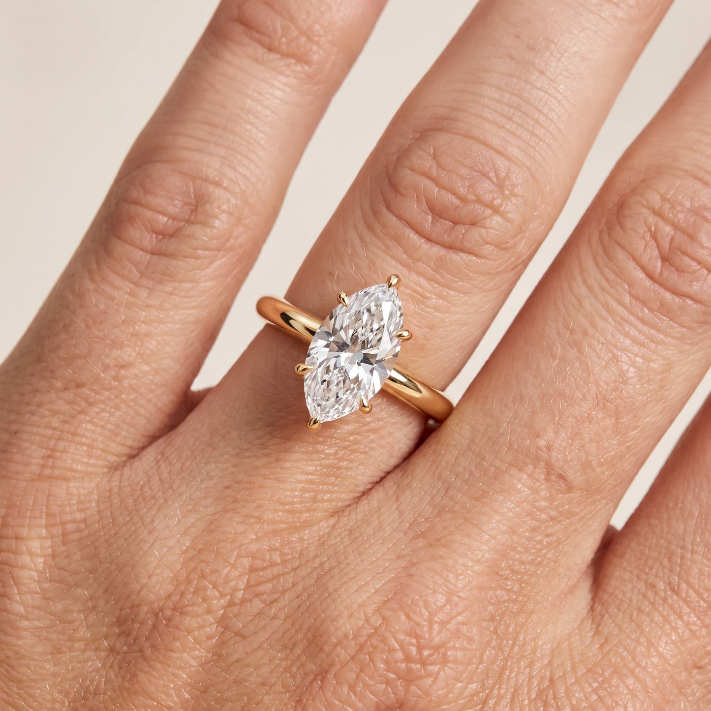 Amaya Hidden Halo Marquise Diamond Ring in Yellow Gold - lifestyle.jpg