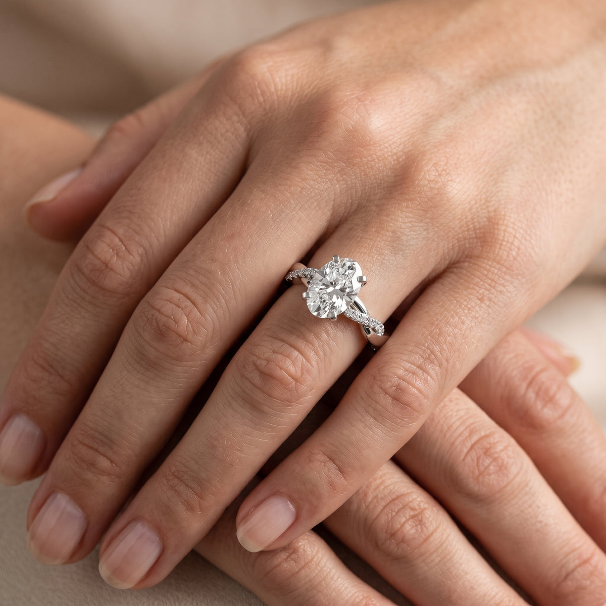 Twisted Side Stone Oval Diamond Engagement Ring in Platinum - lifestyle.jpg