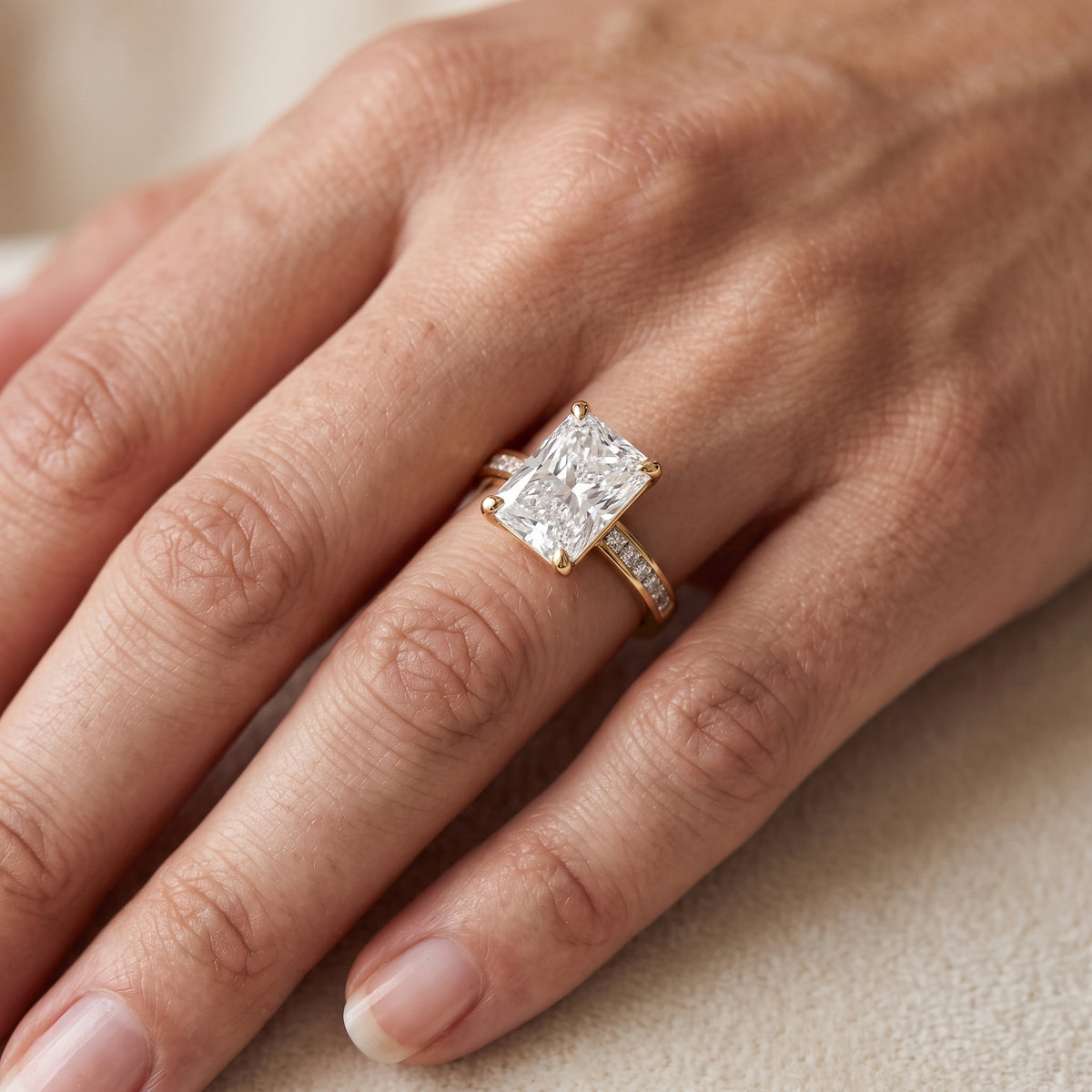 Maren Sidestone Channel Set Radiant Diamond Engagement Ring in Yellow Gold - lifestyle.jpg