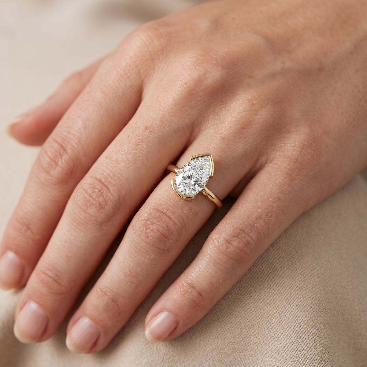 Bedford Half Bezel Solitaire Pear Diamond Engagement Ring in Silver - lifestyle.jpg
