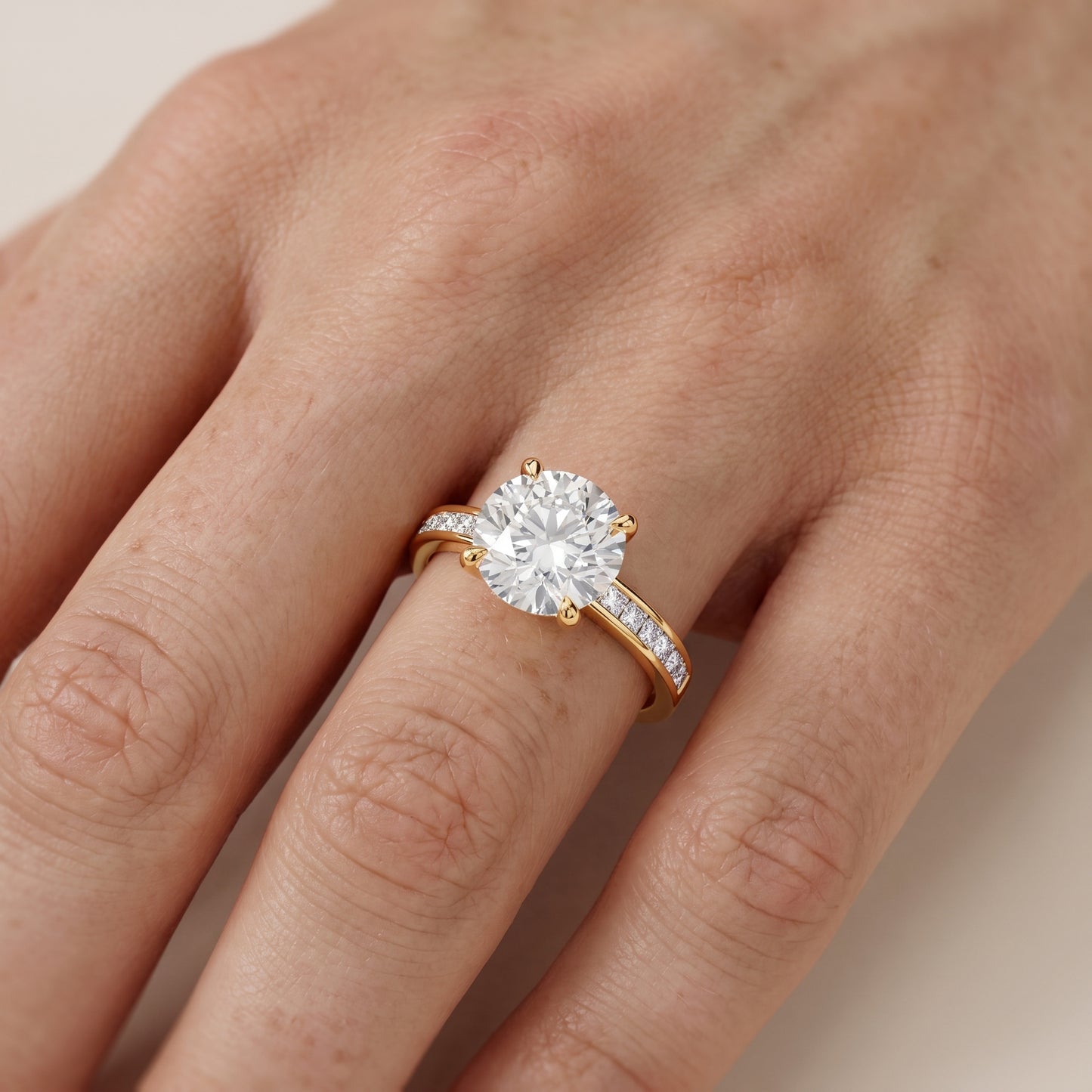 Maren Sidestone Channel Set Round Diamond Engagement Ring in Yellow Gold - lifestyle.jpg