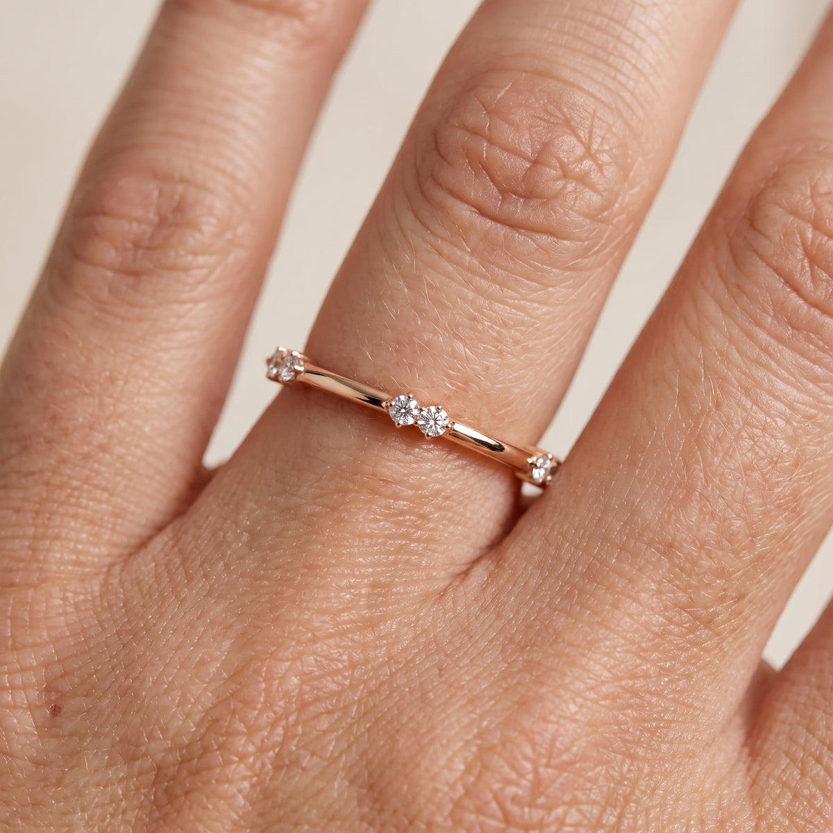 Penelope Claw Prong Round Diamond Wedding Band in Rose Gold - lifestyle.jpg