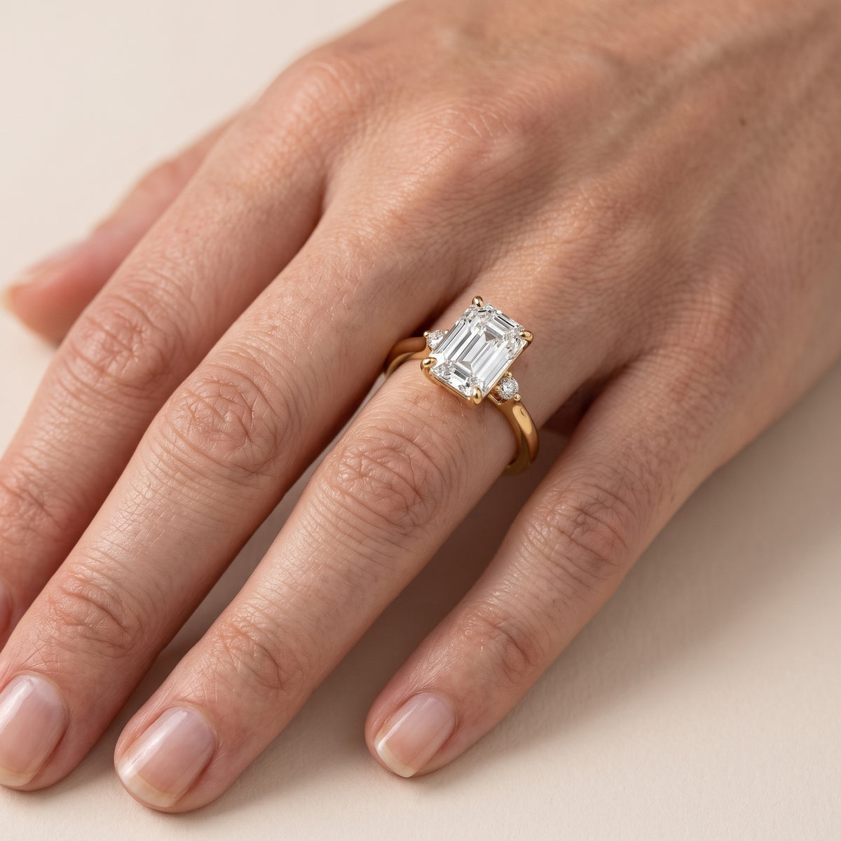 Teodora Floating Three-Stone Emerald Diamond Engagement Ring in Platinum - lifestyle.jpg