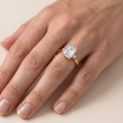 Teodora Floating Three-Stone Emerald Diamond Engagement Ring in Platinum - lifestyle.jpg