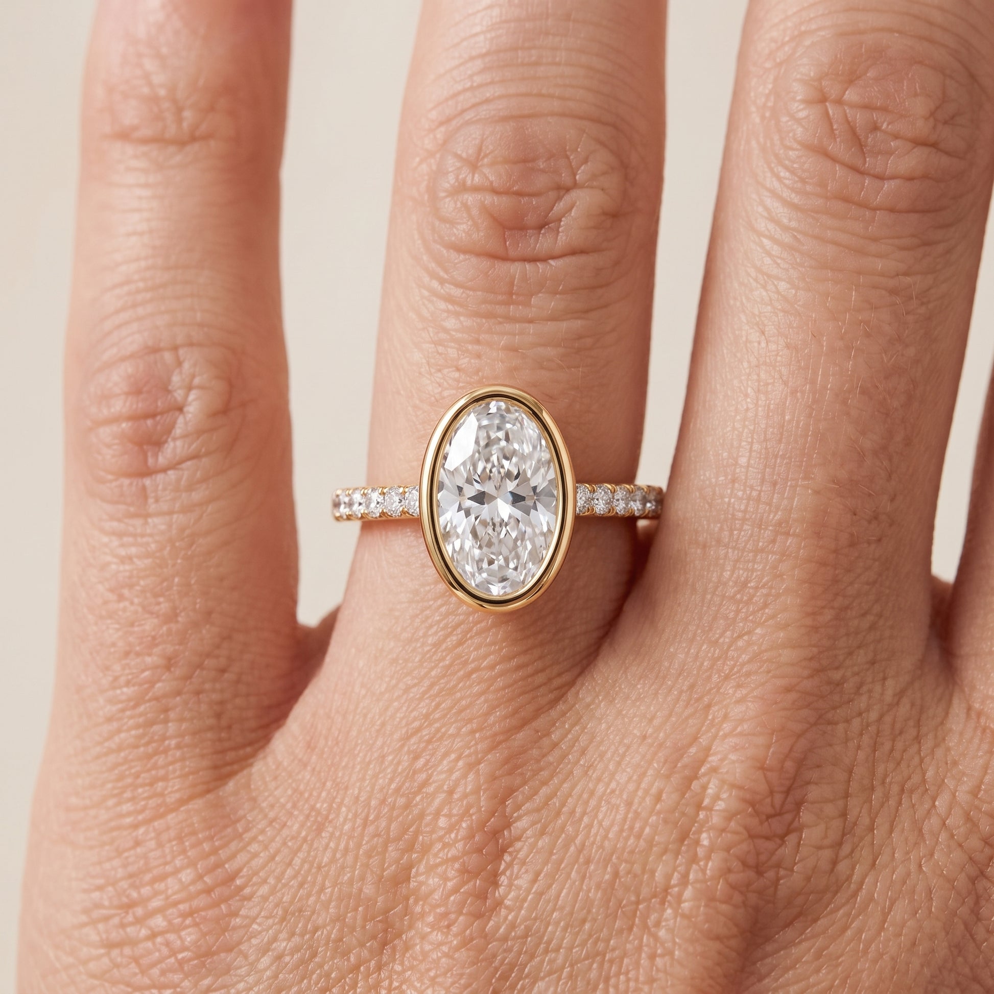 Cora Bezel Pavé Oval Diamond Ring in Yellow Gold - lifestyle.jpg