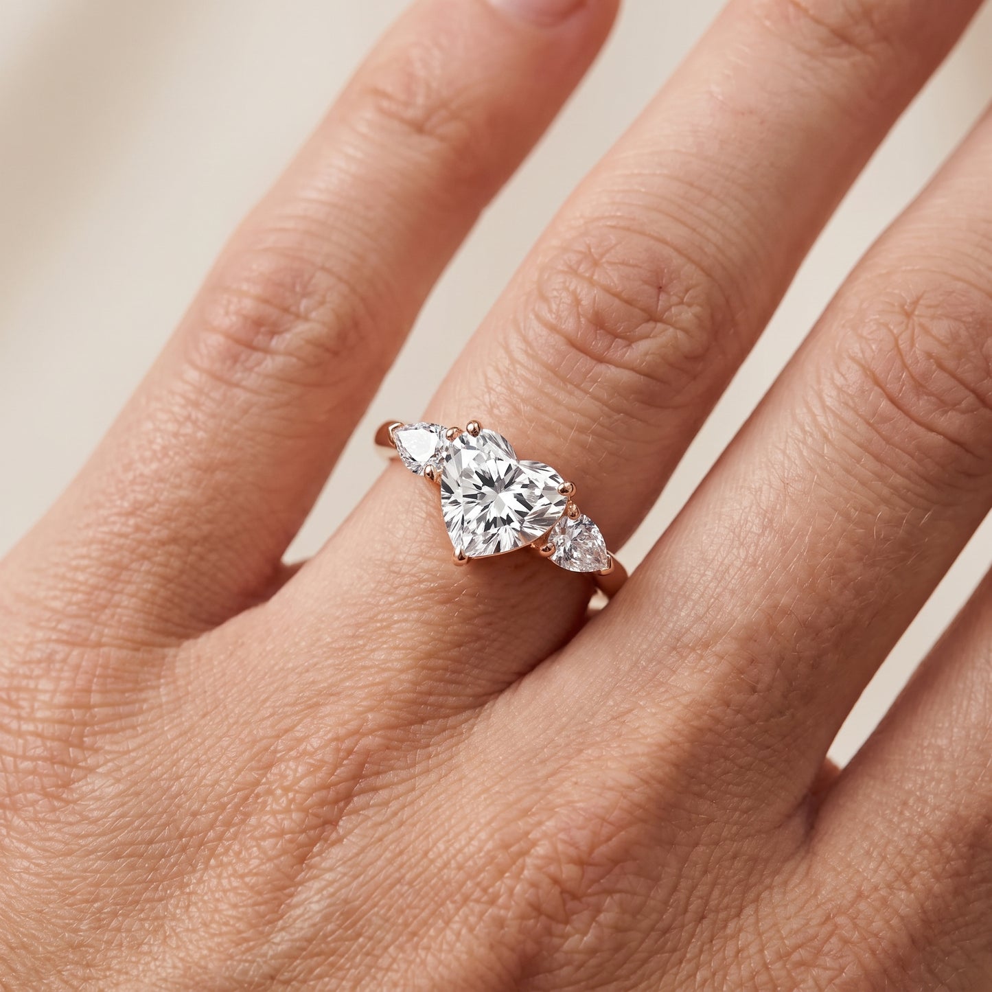 Mirabel Three-Stone Heart Diamond Engagement Ring in Rose Gold - lifestyle.jpg