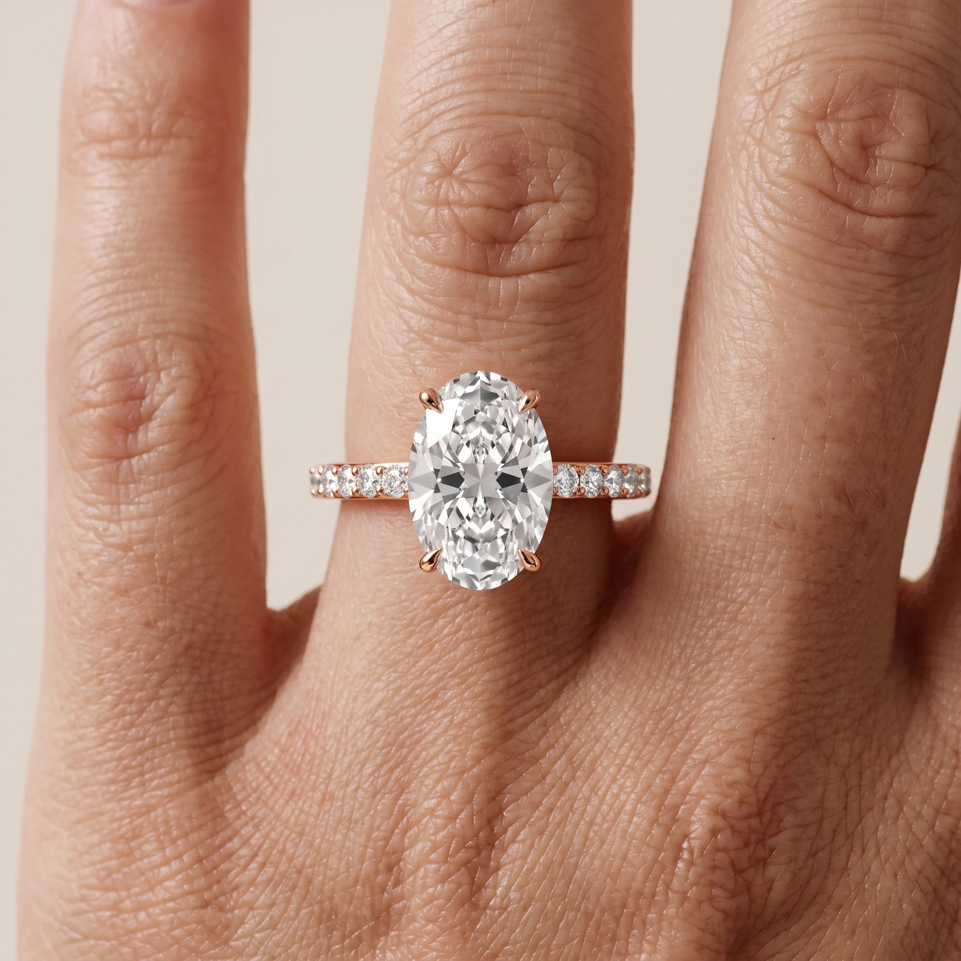 Aisha Pavé Solitaire Oval Diamond Engagement Ring in Rose Gold - lifestyle.jpg
