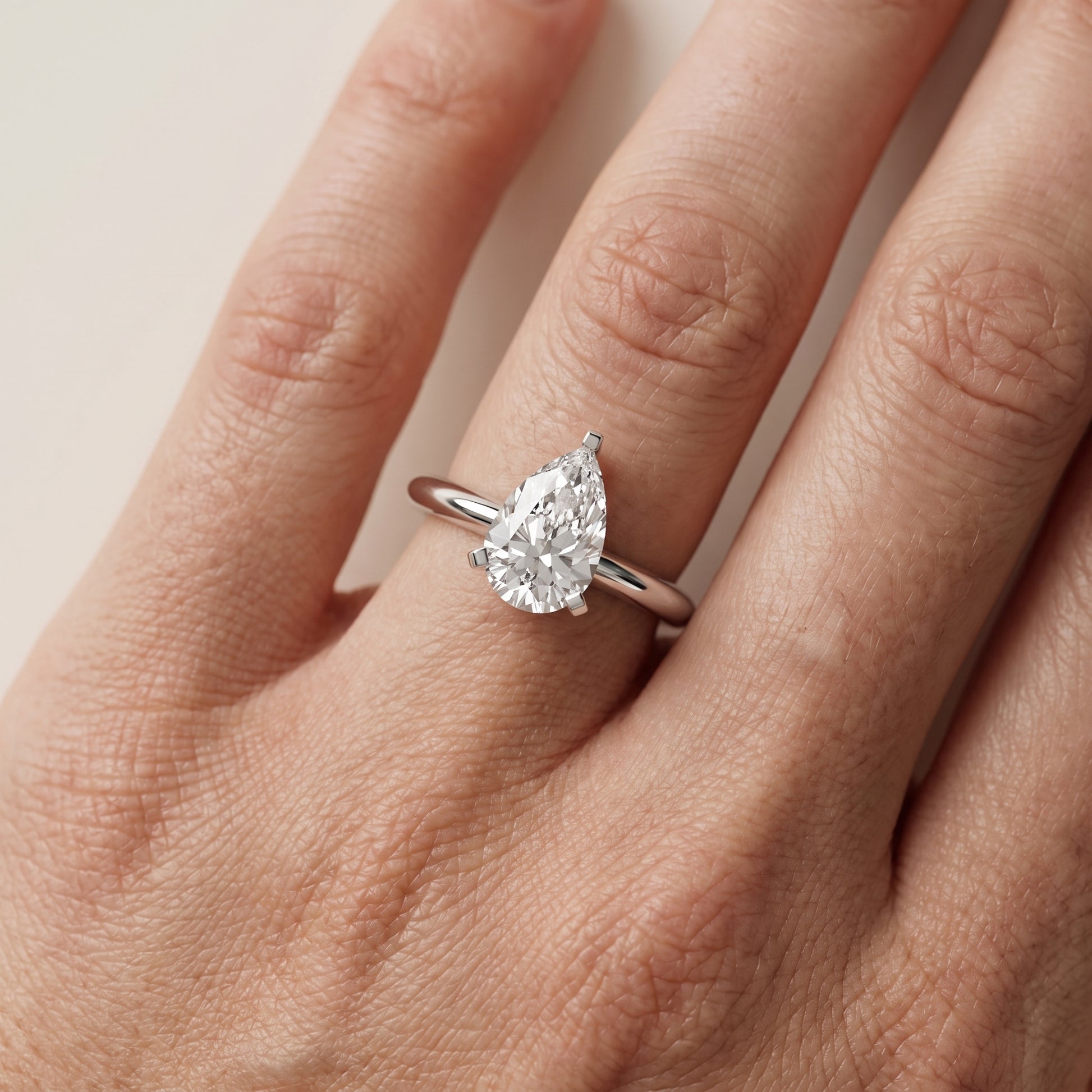 Amira Six-Prong Solitaire Pear Diamond Engagement Ring in Platinum - lifestyle.jpg