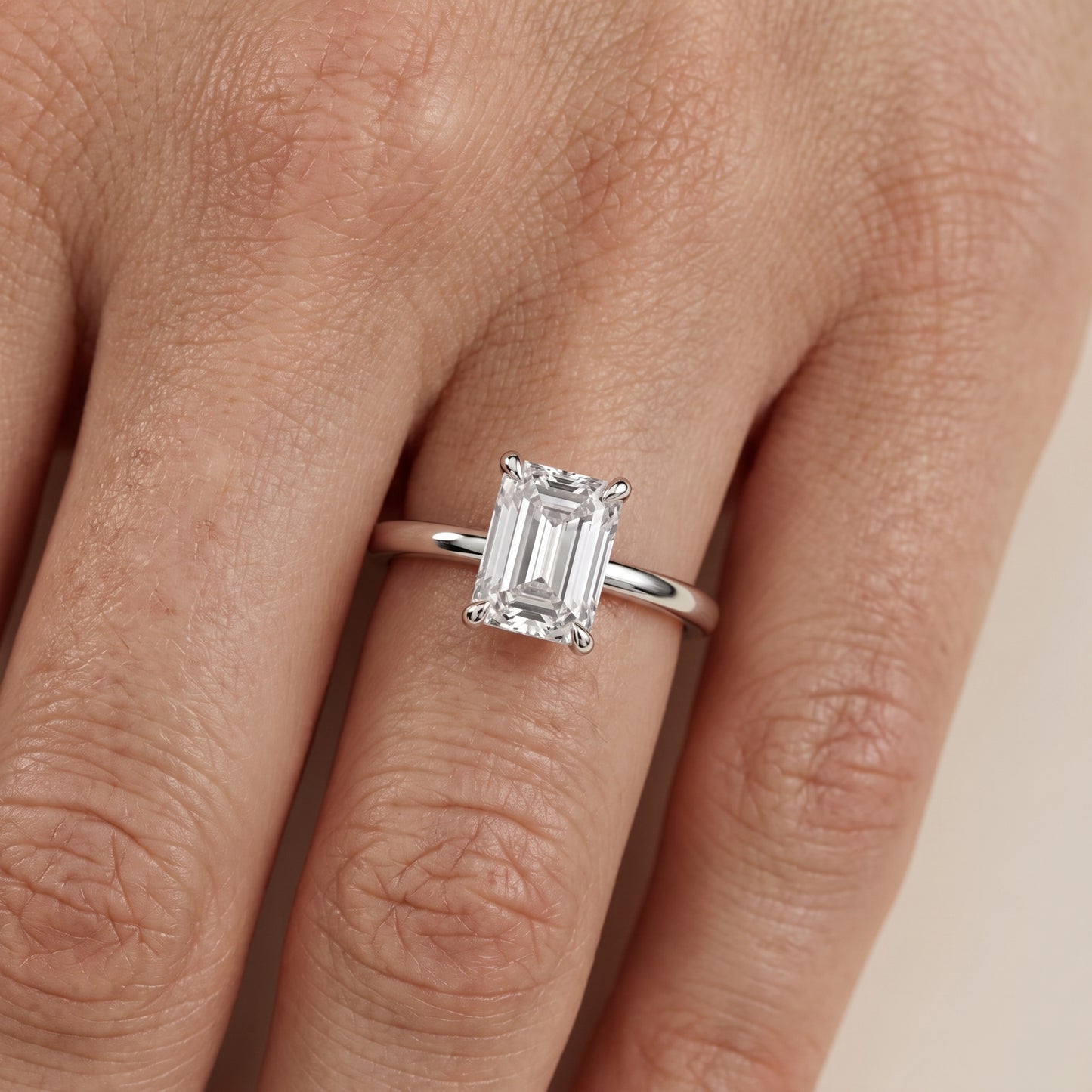 Nella Petite Solitaire Emerald Diamond Engagement Ring in Silver - lifestyle.jpg