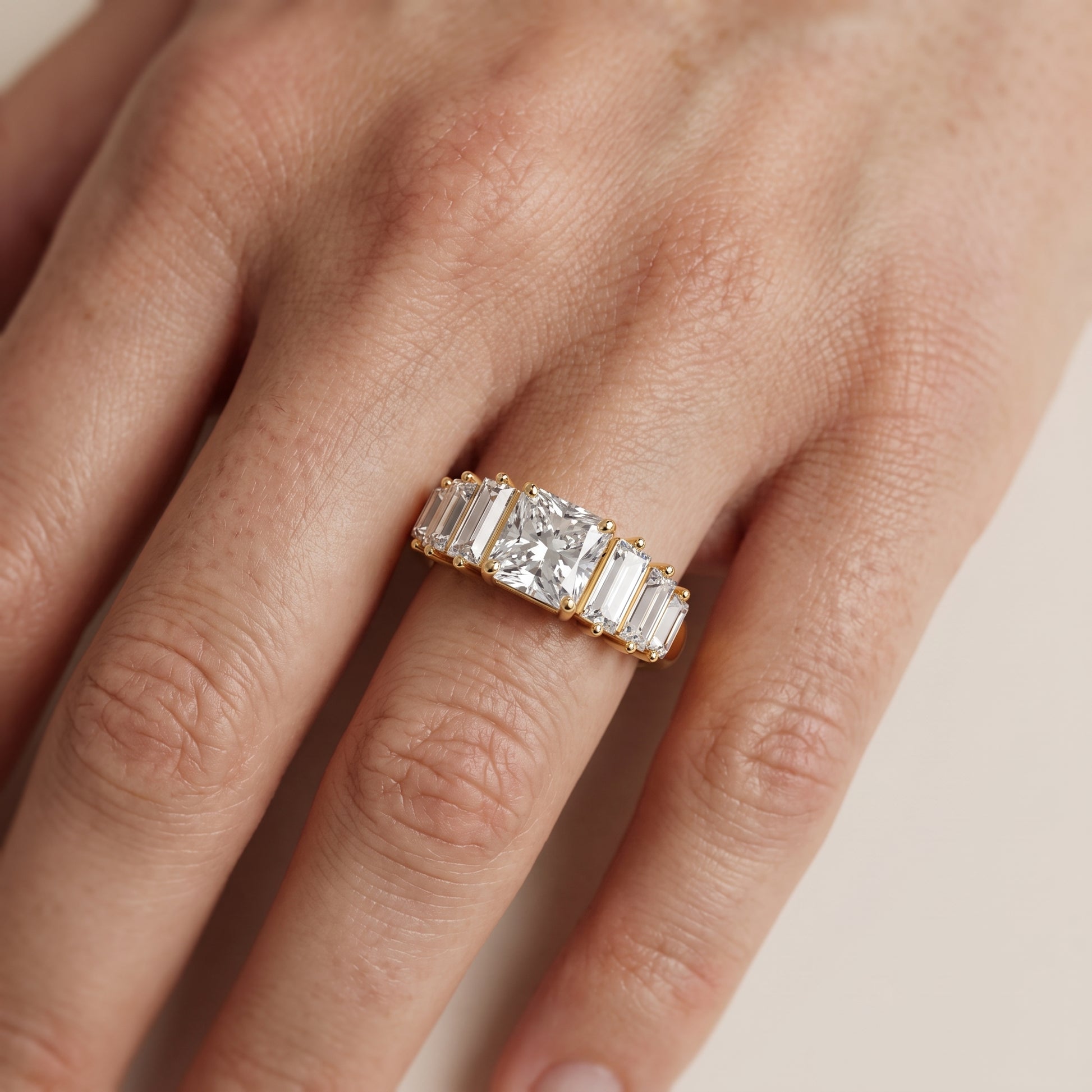 Mara Sidestone Baguette Accent Radiant Diamond Engagement Ring in Yellow Gold - lifestyle.jpg