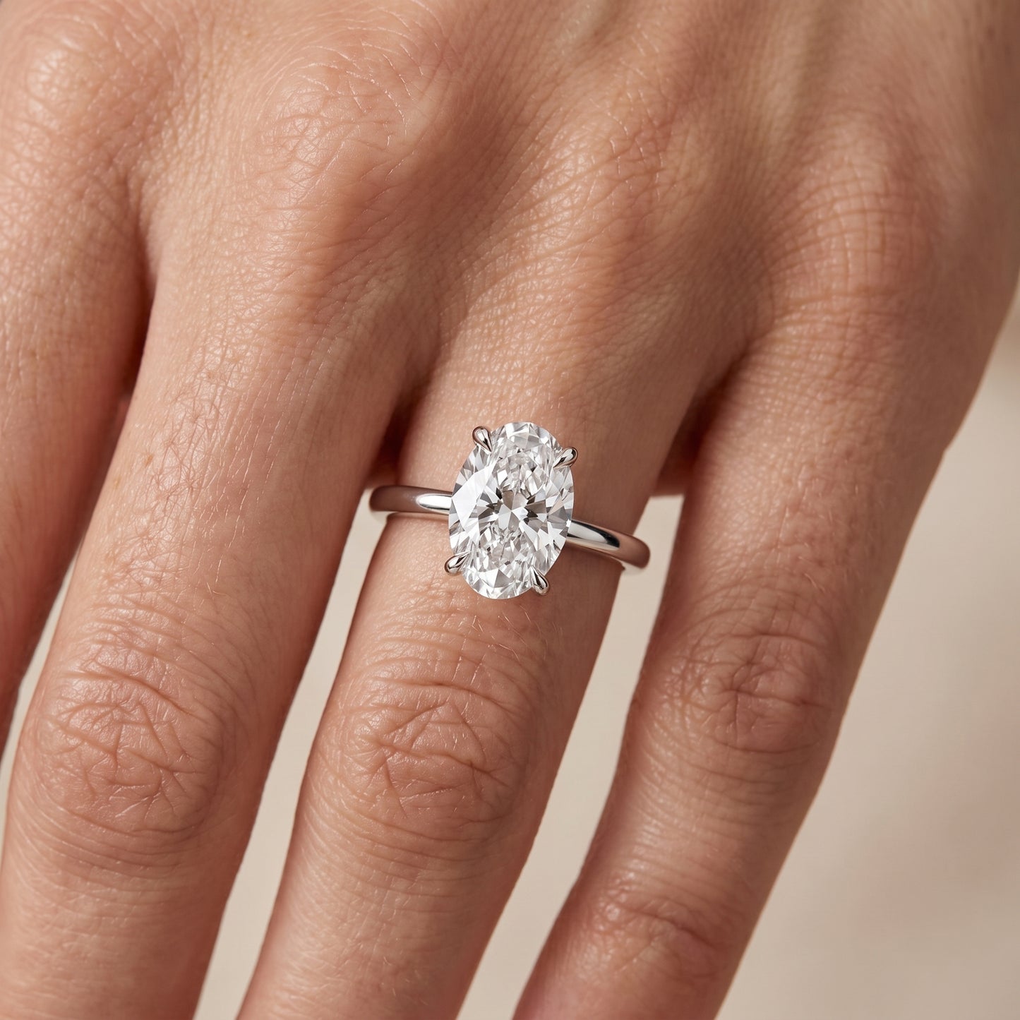 Nella Petite Solitaire Oval Diamond Engagement Ring in Platinum - lifestyle.jpg