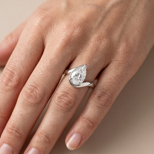 Margaux Bypass Solitaire Pear Diamond Engagement Ring in Platinum - lifestyle.jpg