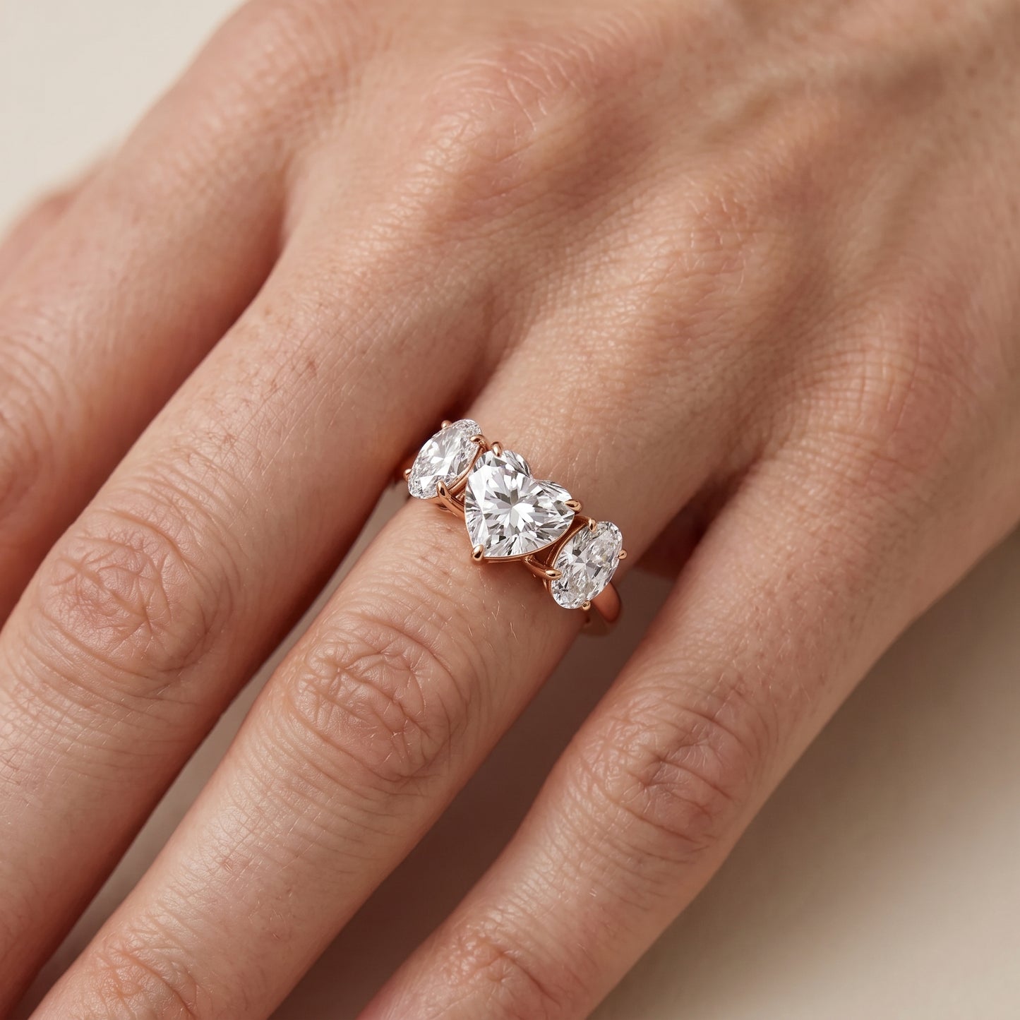 Lila Three-Stone Heart Diamond Ring in Rose Gold - lifestyle.jpg