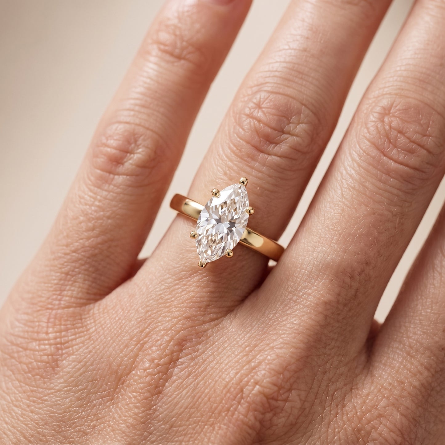 Delia Solitaire Marquise Diamond Engagement Ring in Yellow Gold - lifestyle.jpg
