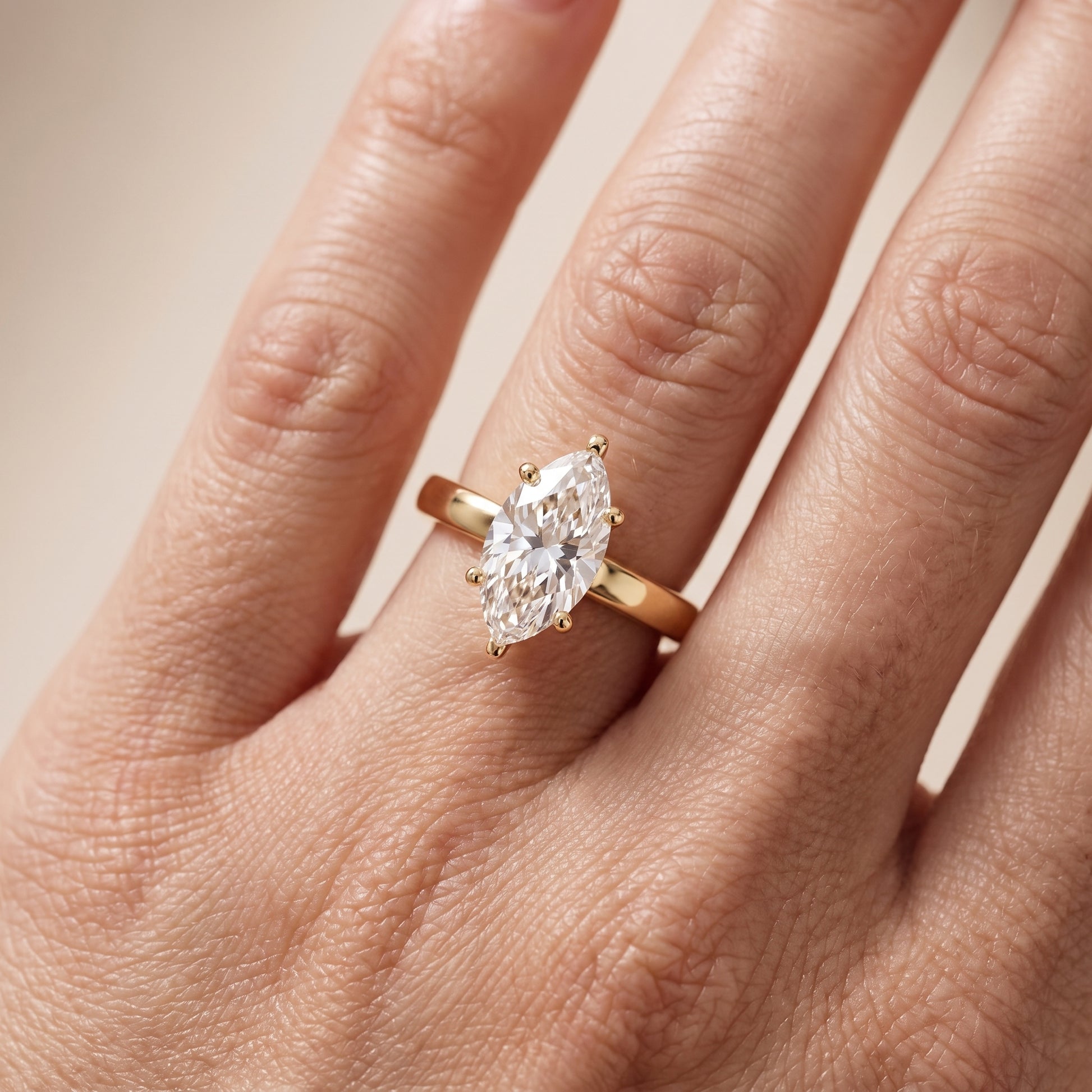 Delia Solitaire Marquise Diamond Engagement Ring in Yellow Gold - lifestyle.jpg