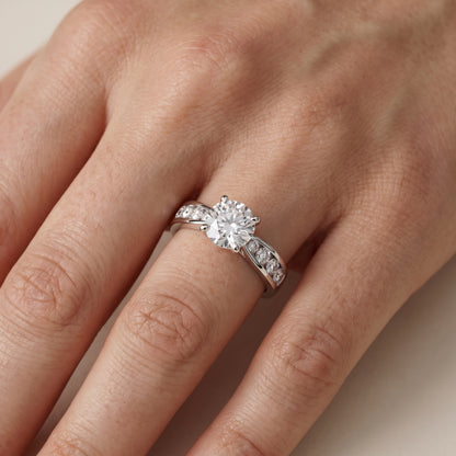 Noor Channel Set Sidestone Round Diamond Engagement Ring in Platinum - lifestyle.jpg
