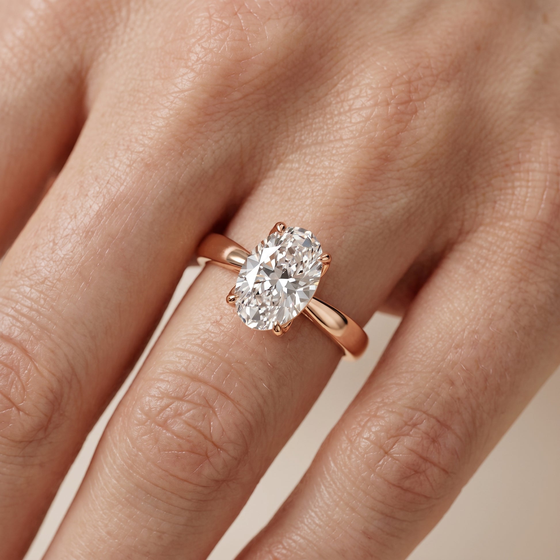 Lucia Solitaire Six-Prong Oval Diamond Engagement Ring in Rose Gold - lifestyle.jpg