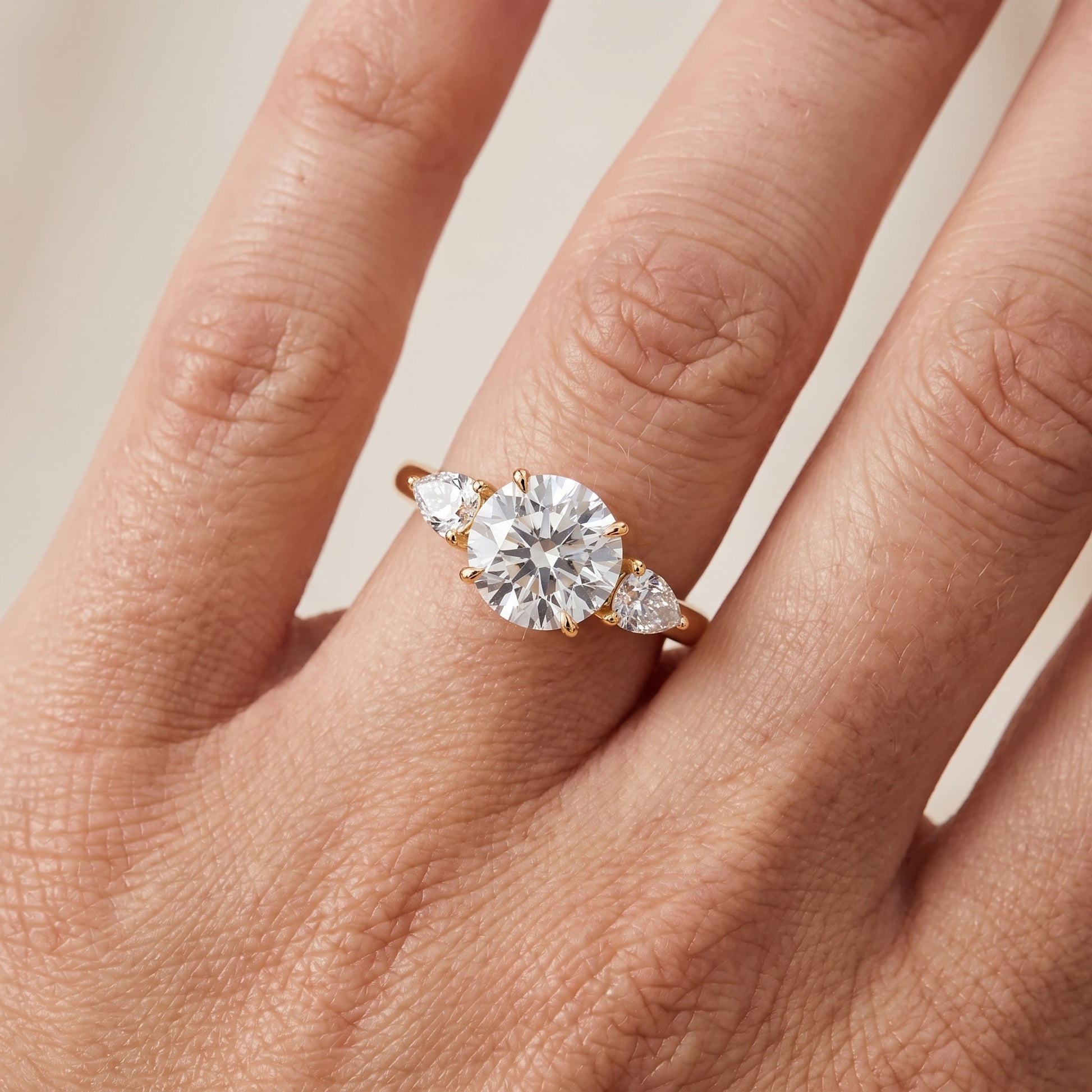 Phoebe Three-Stone Round Diamond Ring in Yellow Gold - lifestyle.jpg